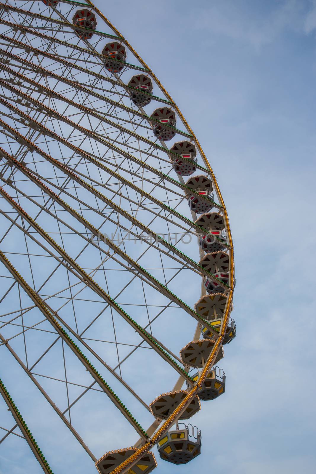 Ferris wheel in front of a blue sky