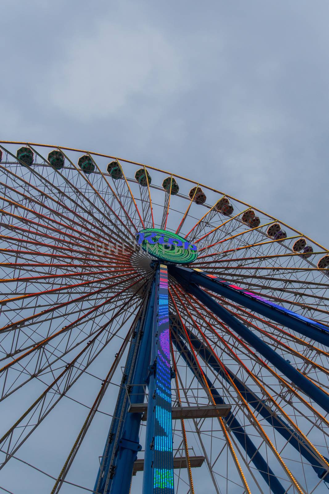 Ferris wheel in front of a blue sky by sandra_fotodesign