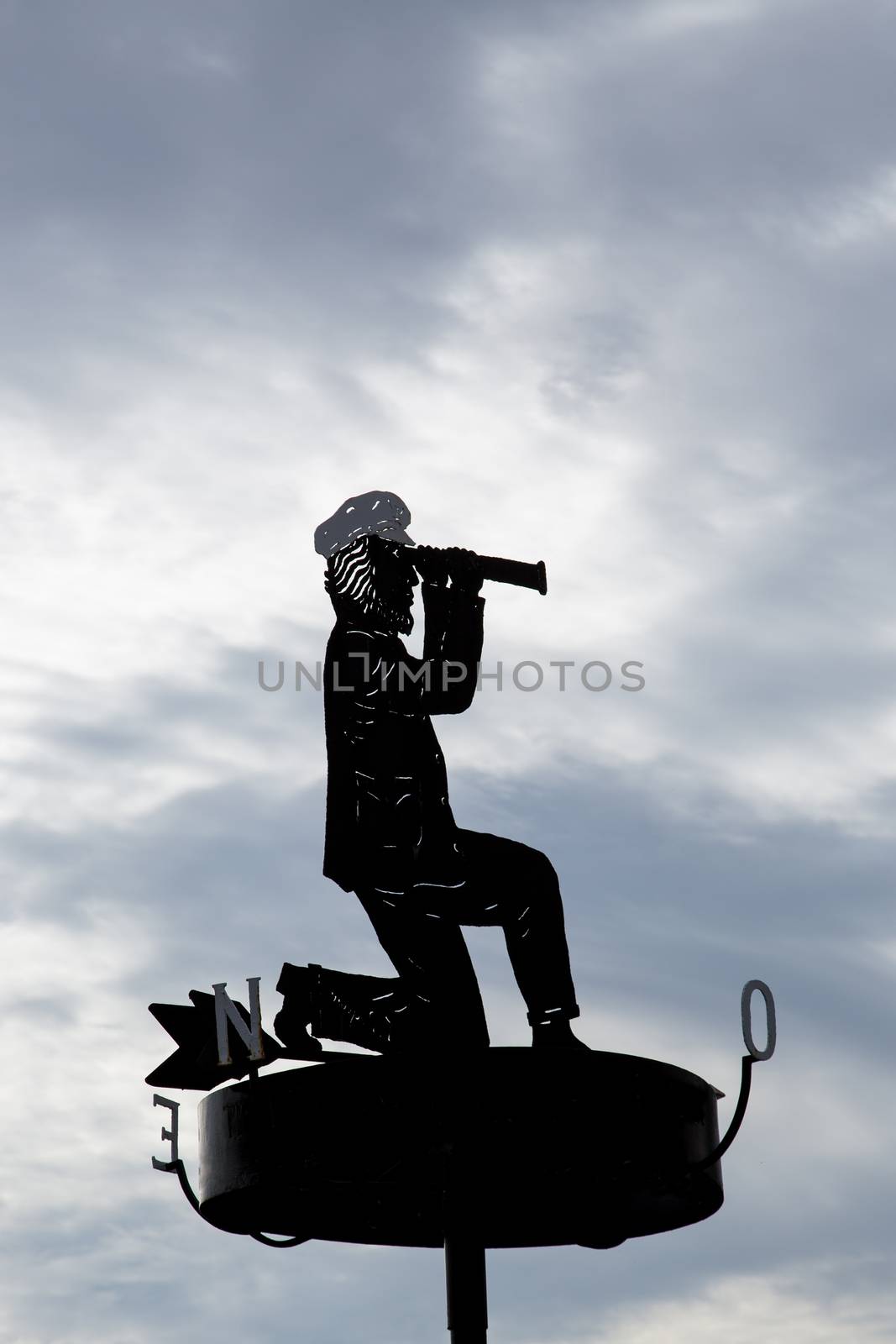 Captain with binoculars as a signpost by sandra_fotodesign