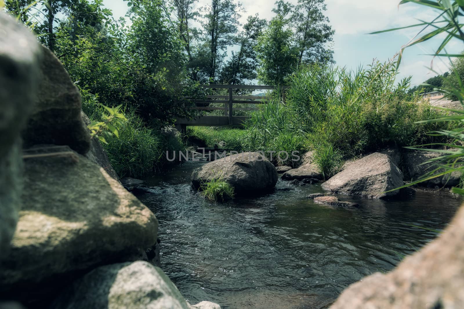 View between stones on a small river by sandra_fotodesign