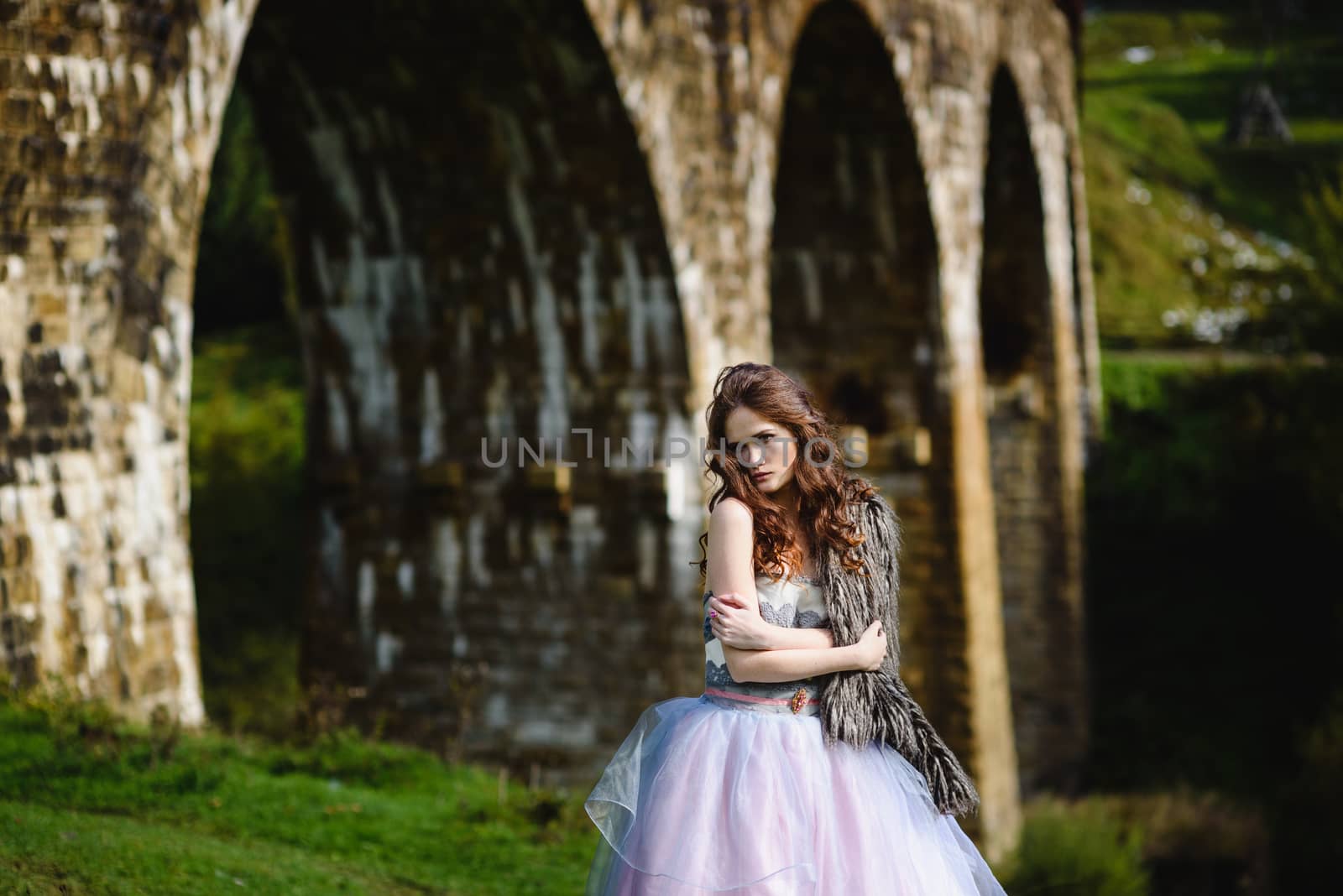 bride walks under a bridge by Andreua