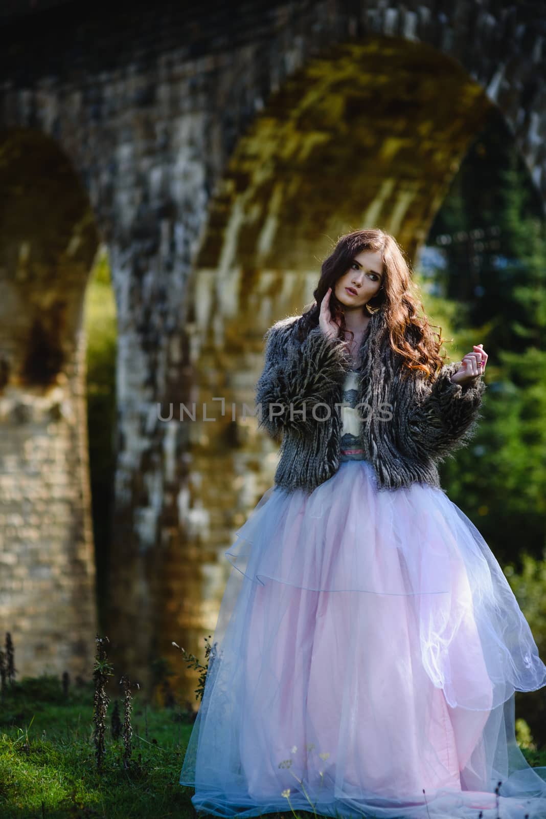 bride walks under a bridge by Andreua