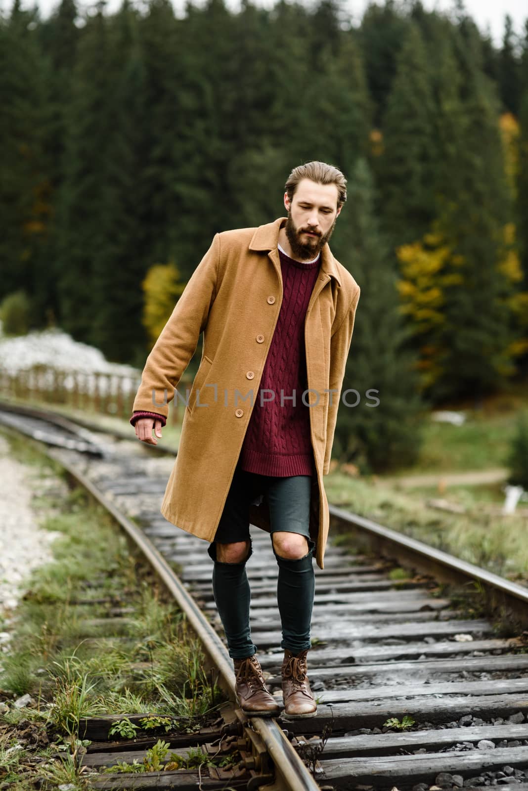 brutal bearded man walks on the tracks by Andreua