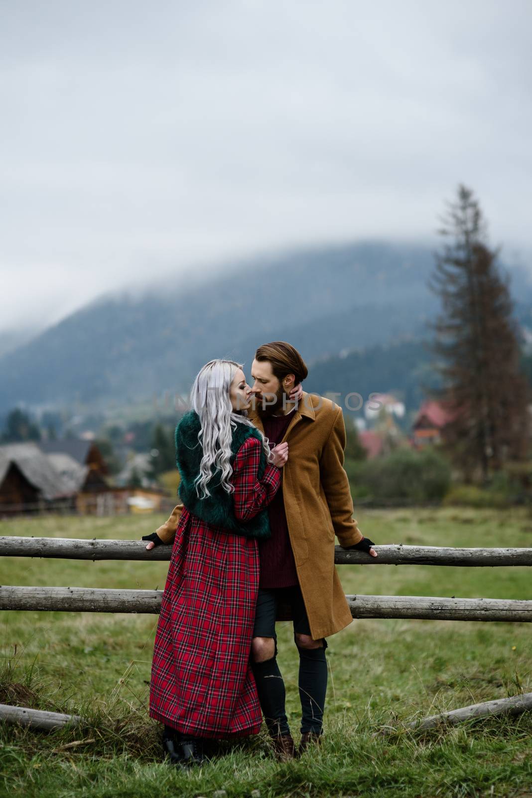 pair of lovers in the Carpathian mountains in national costumes