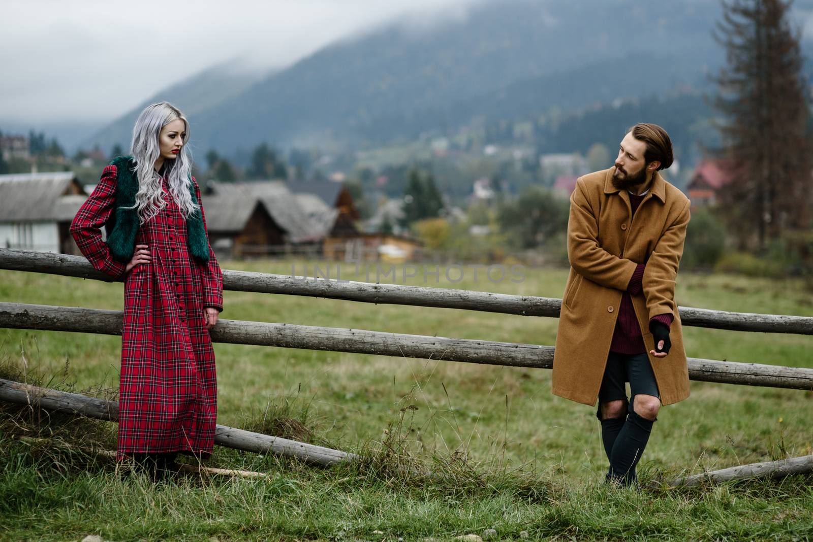 pair of lovers in the Carpathian mountains in national costumes