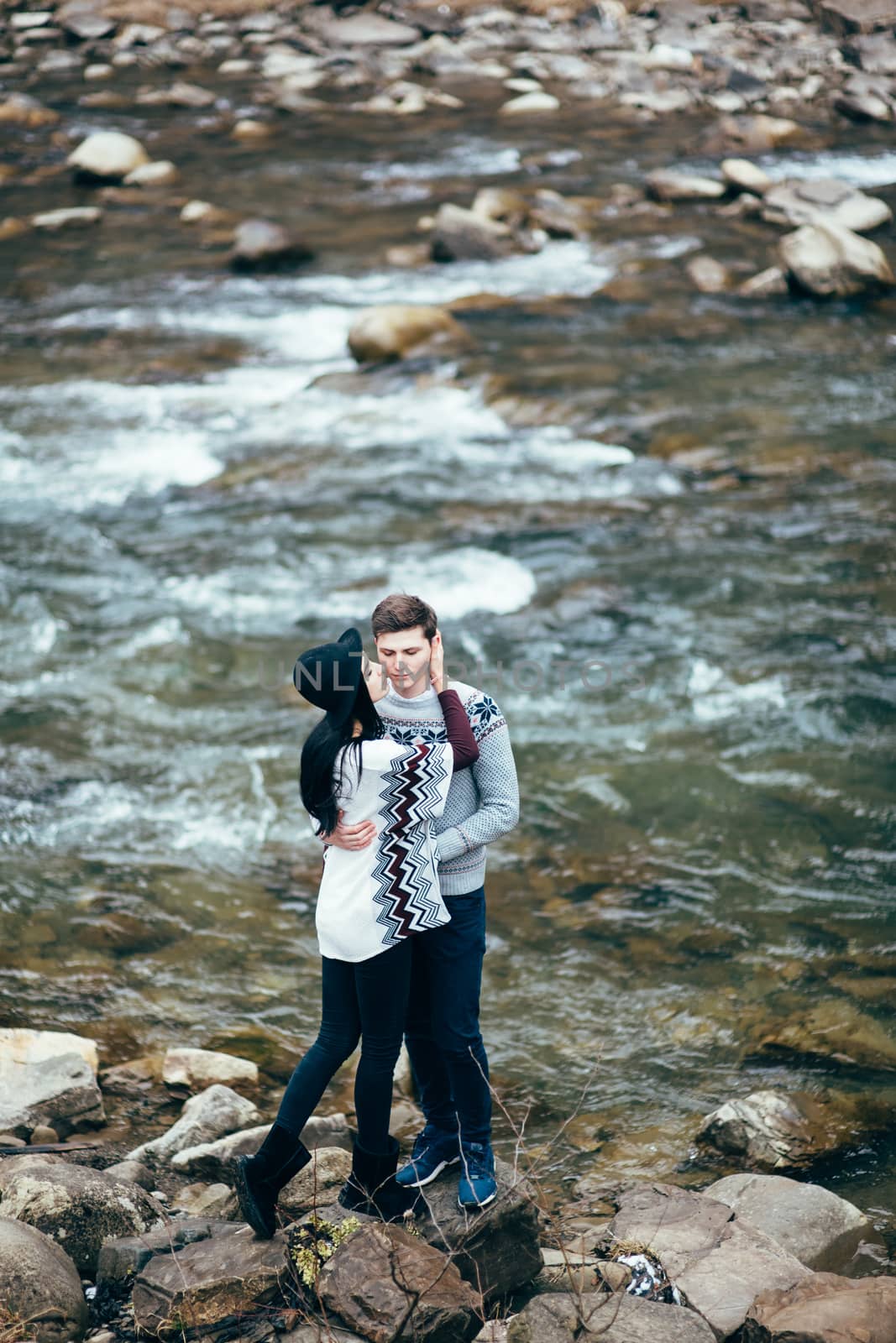 guy and girl along a mountain river by Andreua