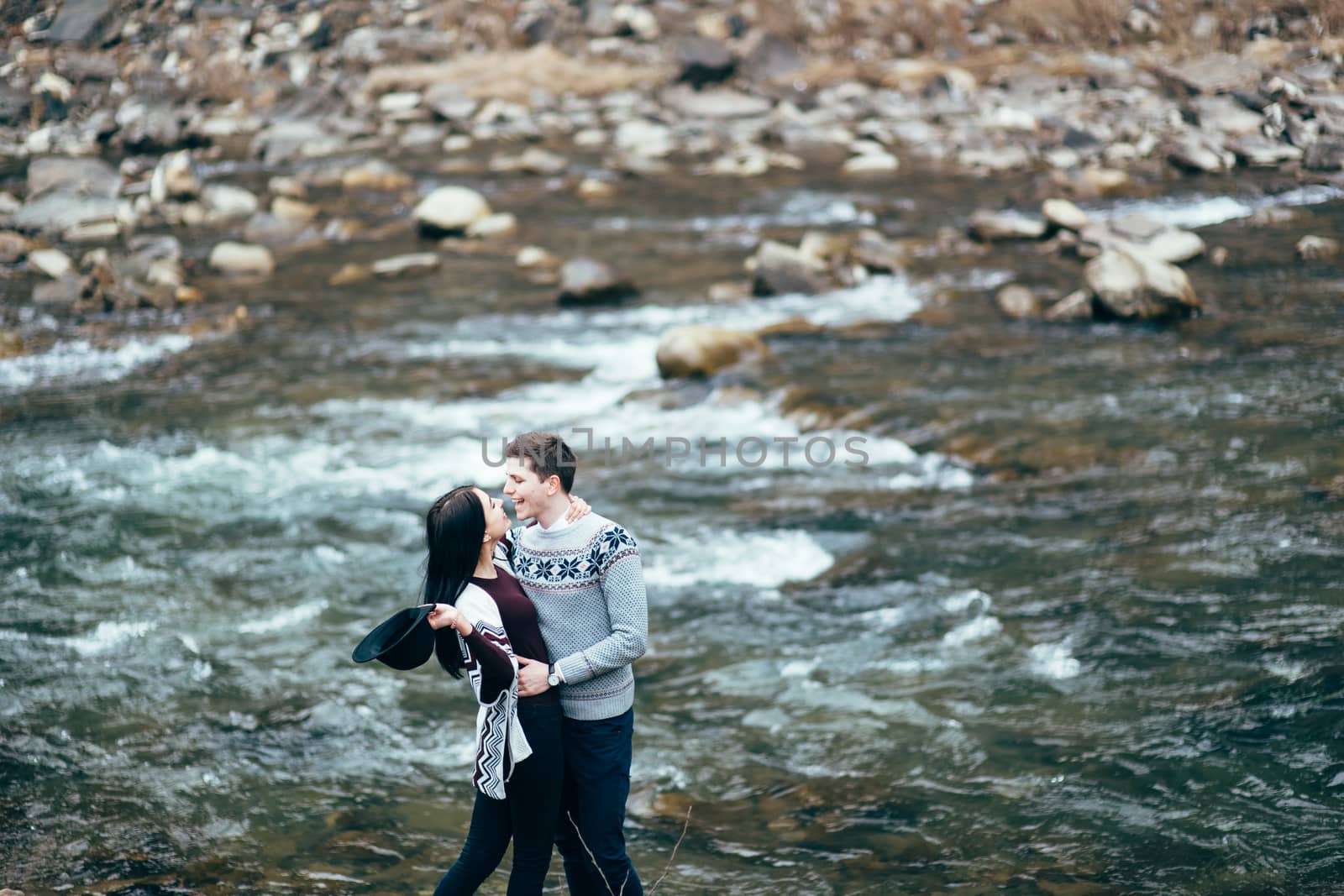 guy and girl along a mountain river by Andreua