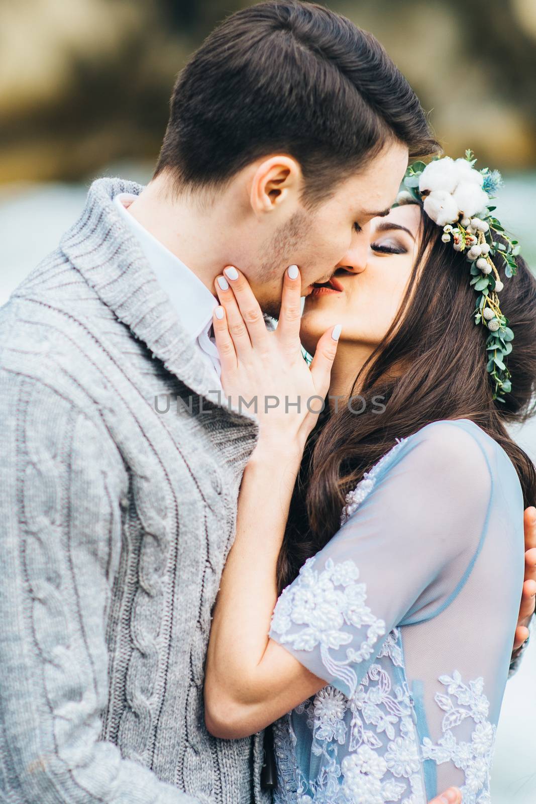 Сouple of newlyweds in the Carpathian waterfall, a wedding walk