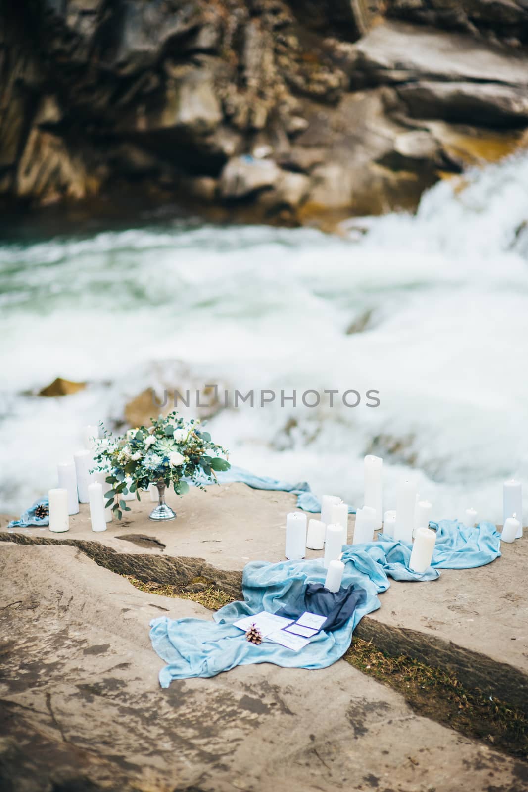 Сouple of newlyweds in the Carpathian waterfall, a wedding walk