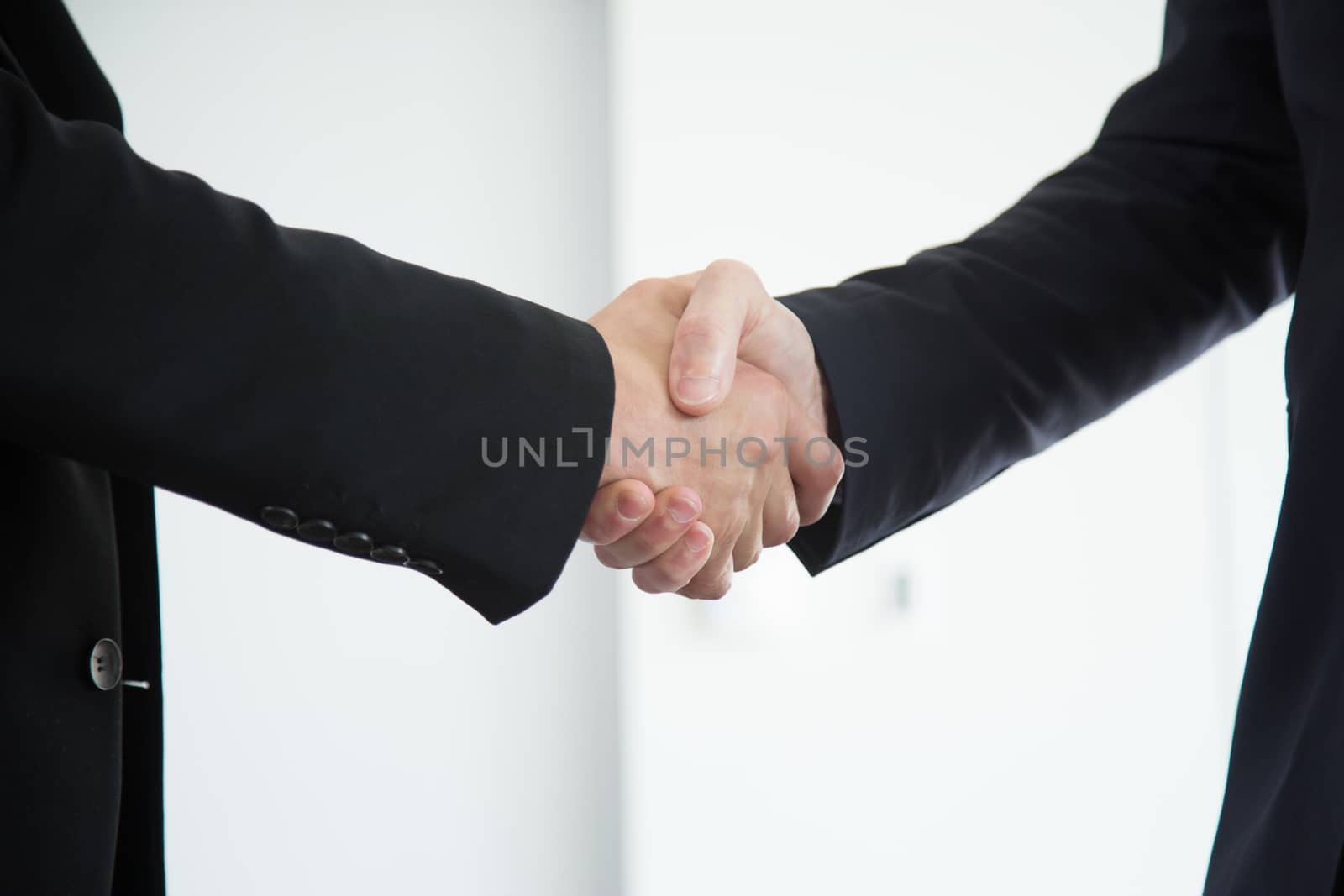 Business handshake close up by ALotOfPeople