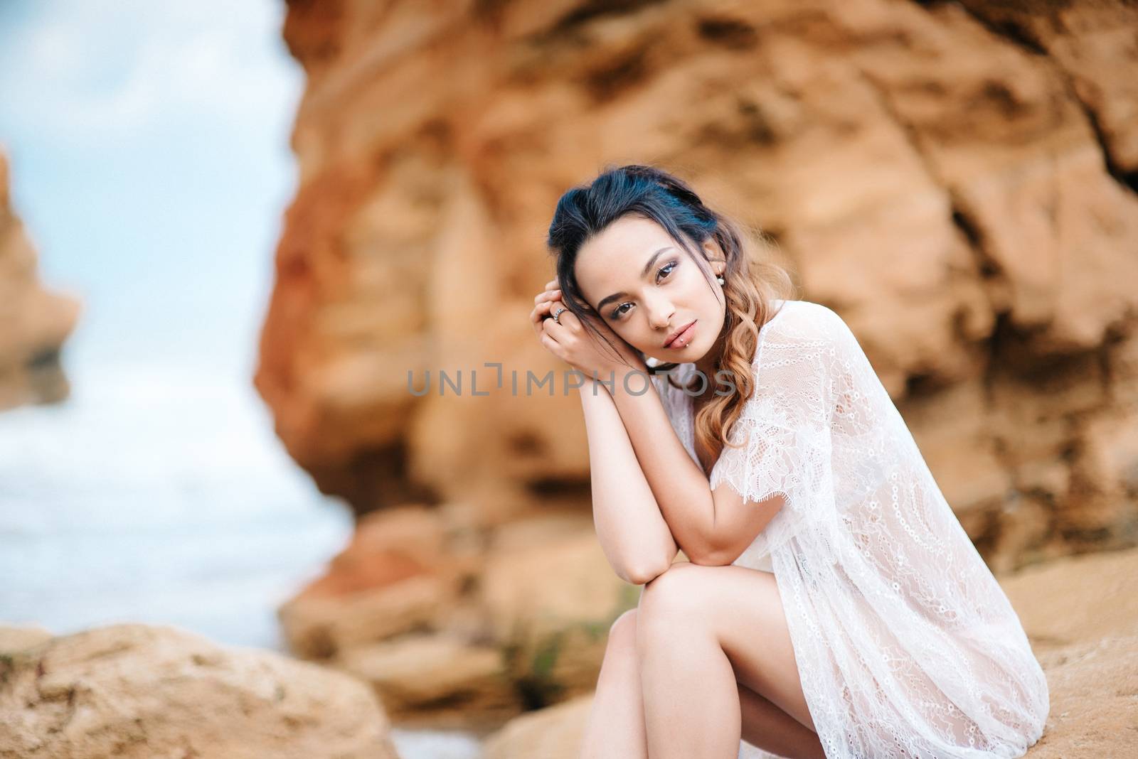 young girl bride in her underwear on the shore of the sea dreams of the future