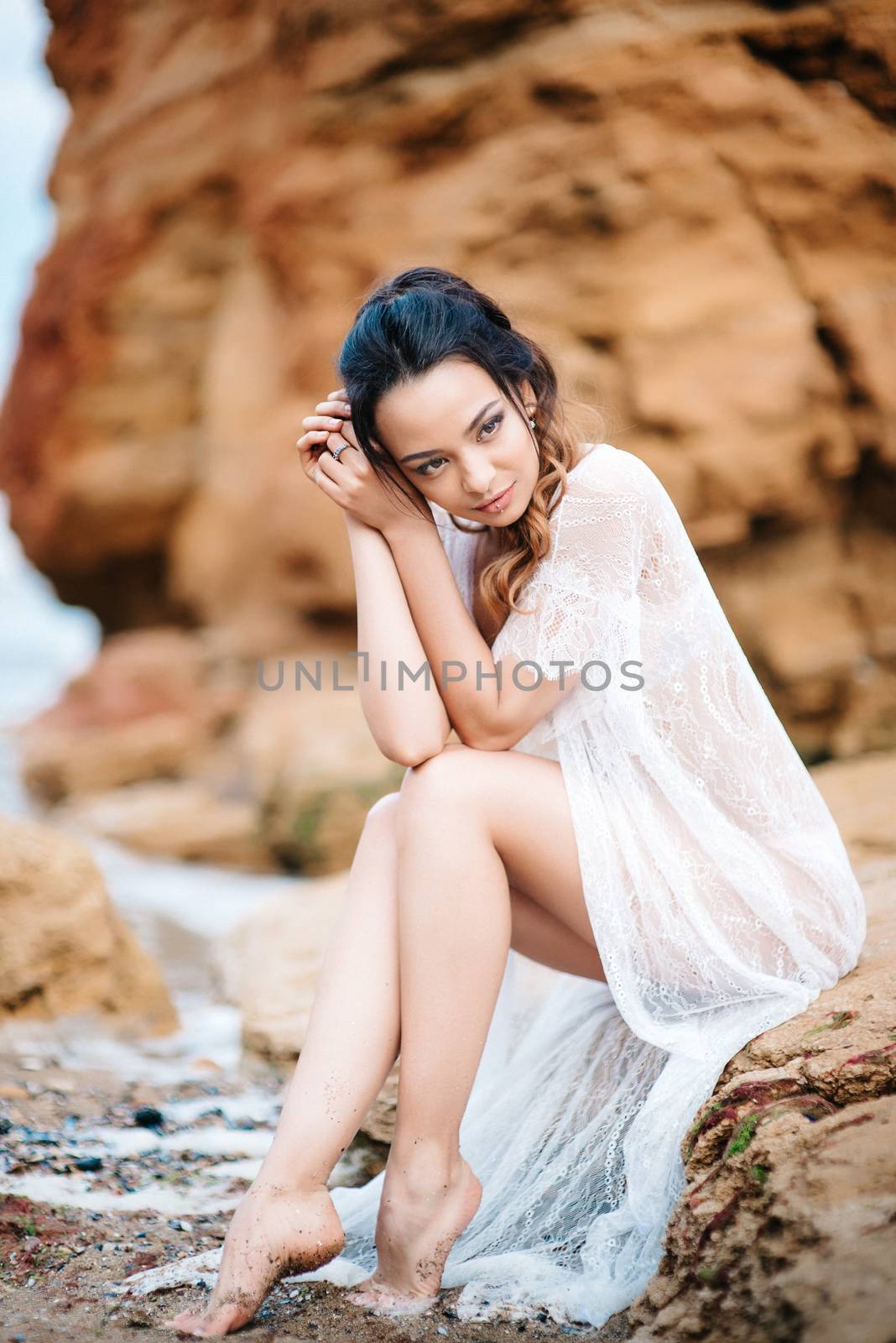 young girl bride in her underwear on the shore of the sea dreams of the future