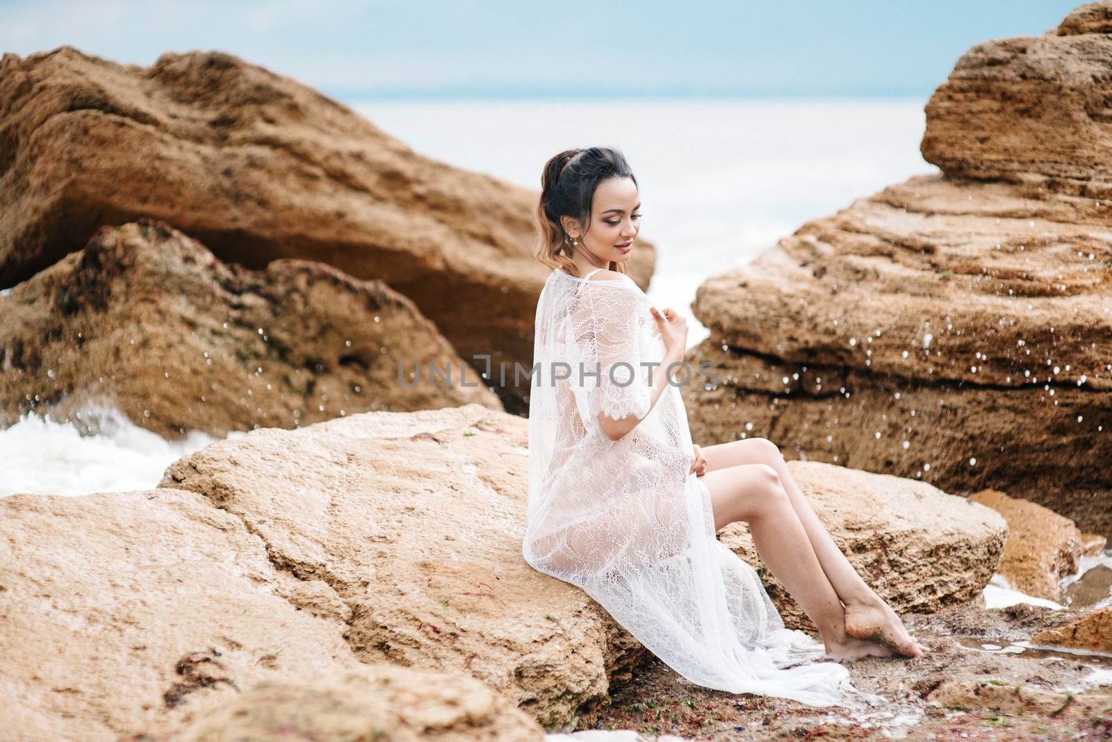 young girl bride in her underwear on the shore of the sea dreams of the future