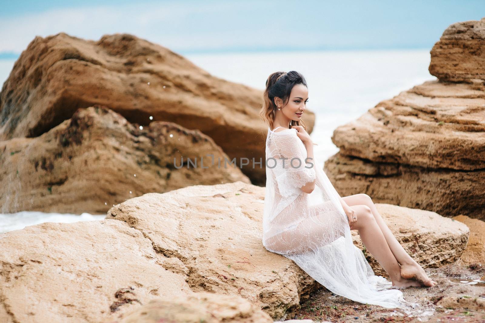 young girl bride in her underwear on the shore of the sea dreams of the future