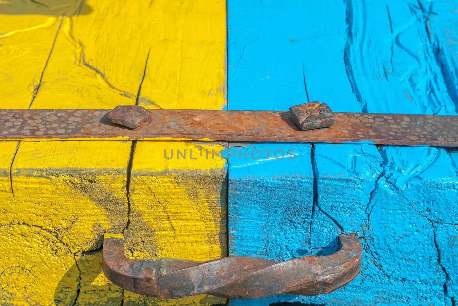 painted wooden surface, yellow and blue colors texture, background by uvisni