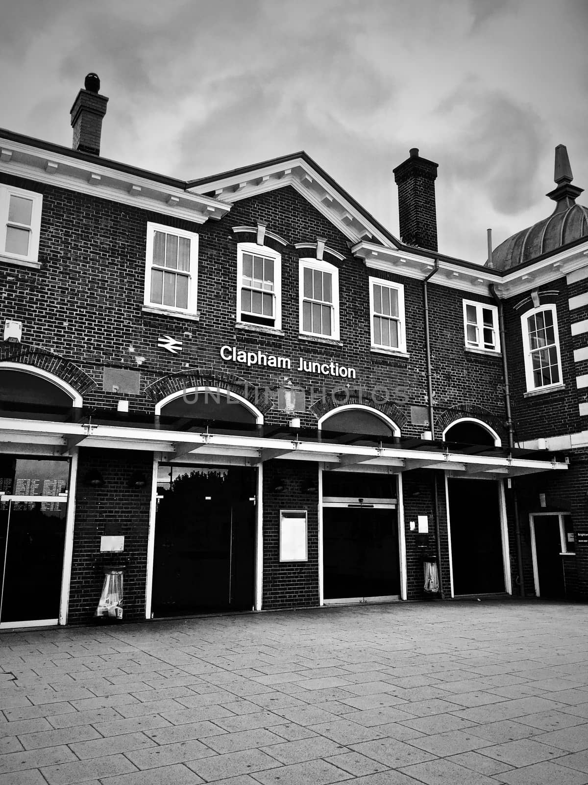 Train station in Clapham Junction, London. Old brick buildings. Architecture. Black and white photography.