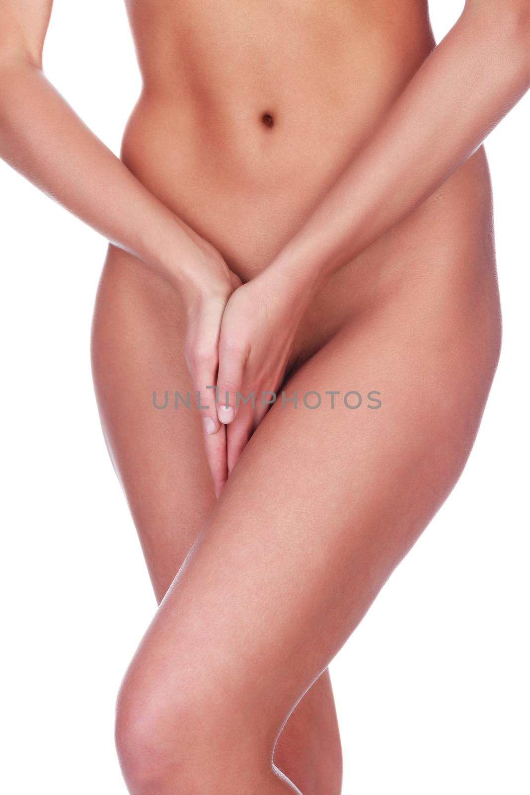 Closeup shot of woman holding her hands between the legs, isolated on white background