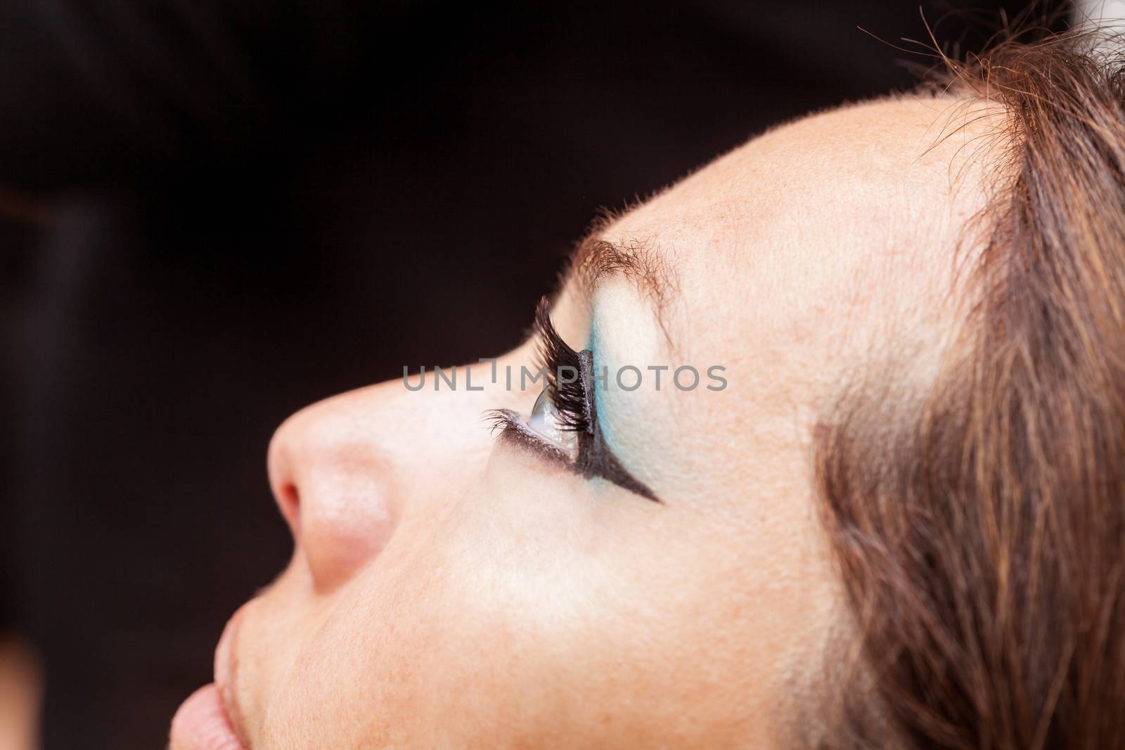 Close up of a woman with false eyelashes