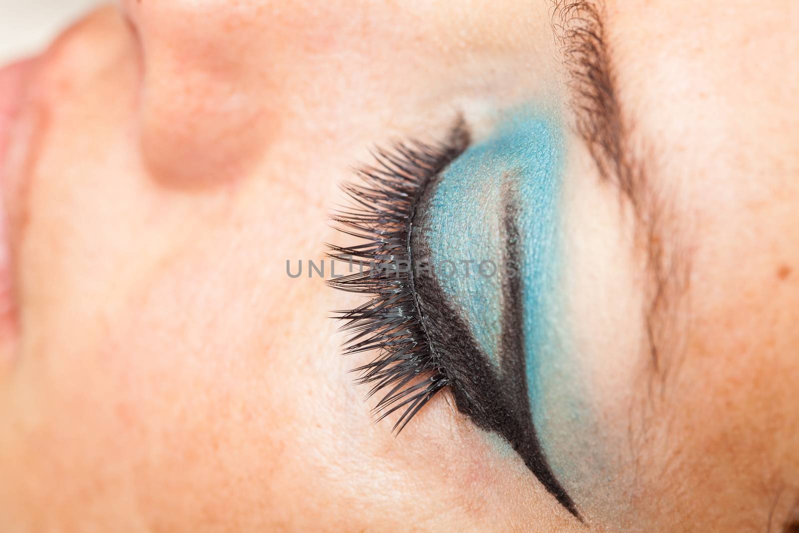 Close up of a woman eye with false eyelashes