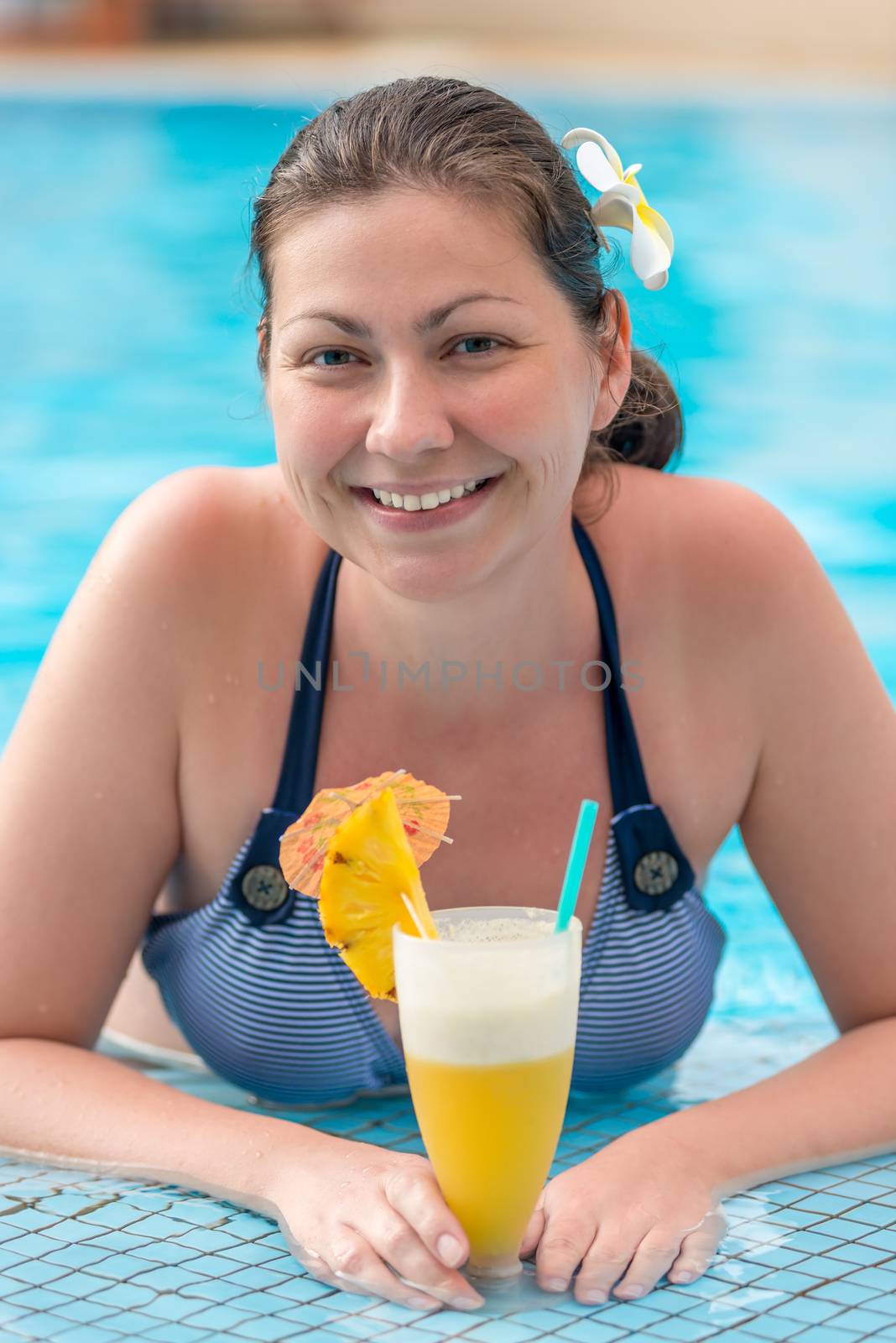 vertical portrait of a woman in a bikini in a pool with a cockta by kosmsos111