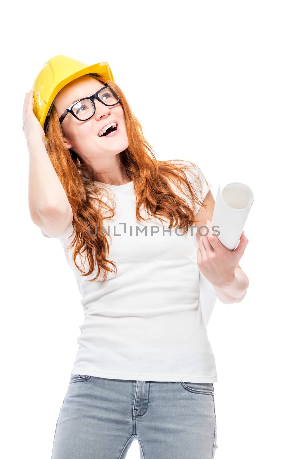 Cheerful woman in yellow helmet in studio posing