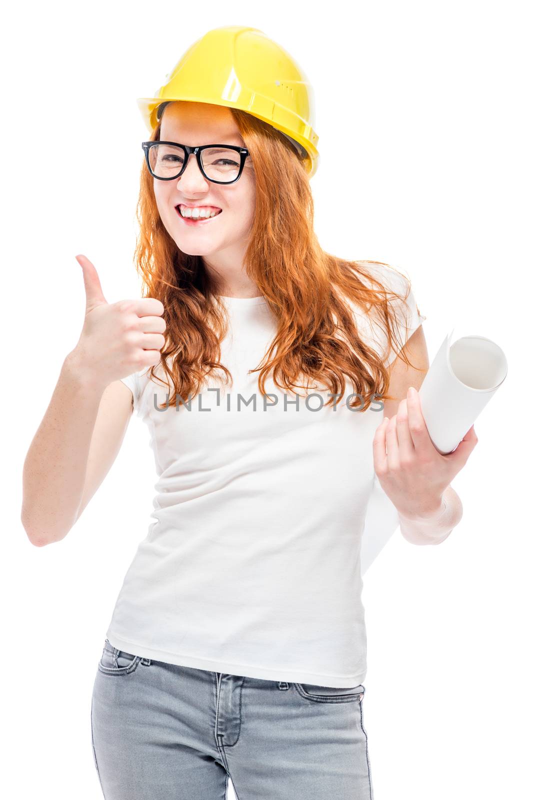 beautiful girl in a white T-shirt with blueprints is wearing a yellow hard ha