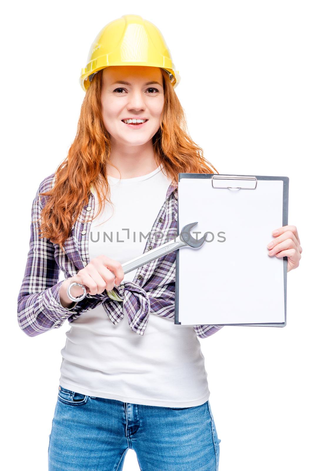 Happy successful woman in the yellow helmet with a key and application form for the inscription