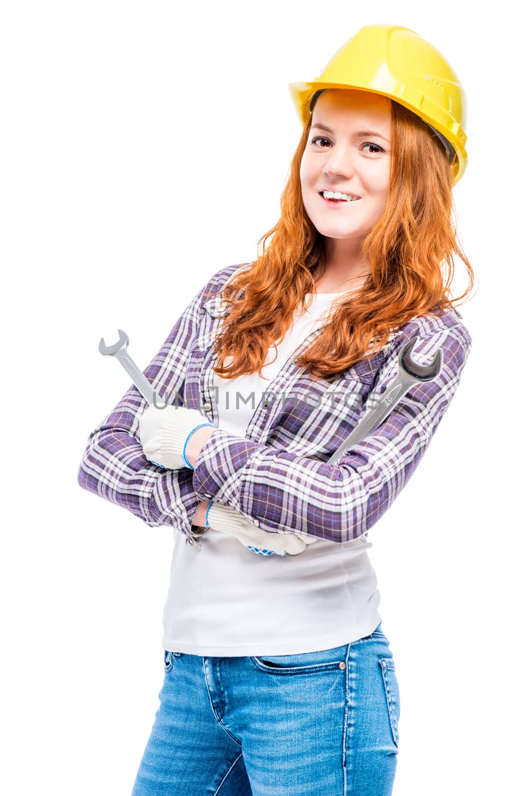 portrait of a woman in a helmet with mechanic keys on a white background