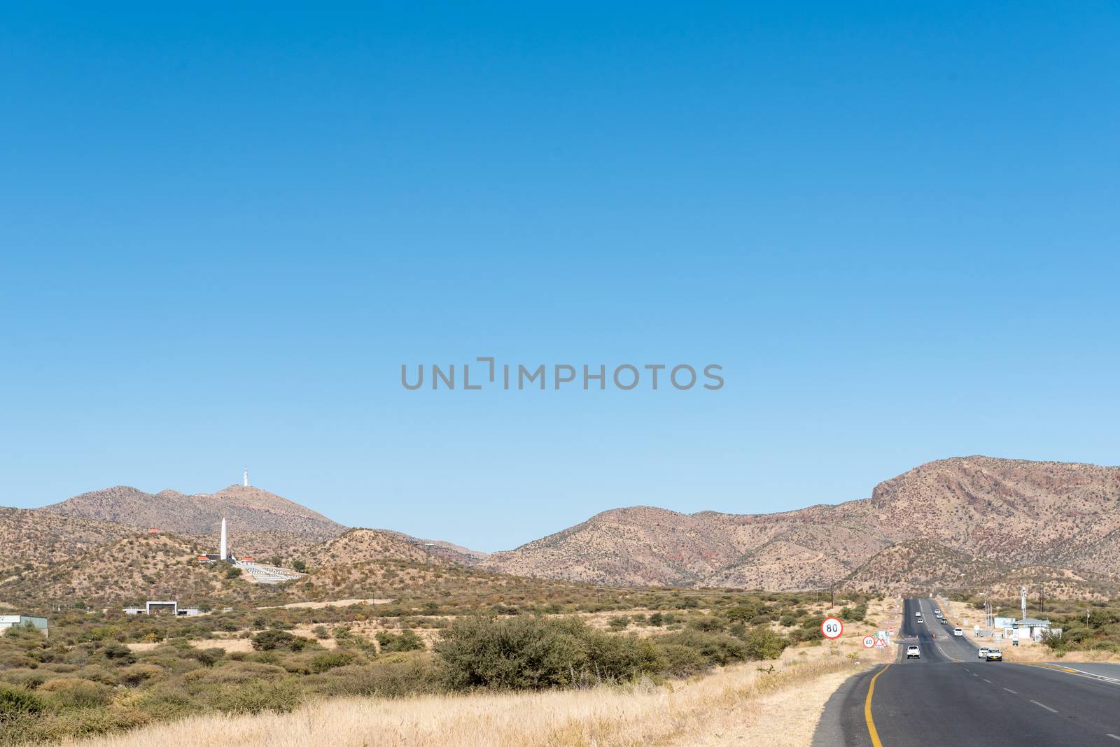 Looking South on the B1-road South of Windhoek. The Heroes Acre is visible as well as a microwave telecommunications tower on Grossherzog Friedrich Mountain