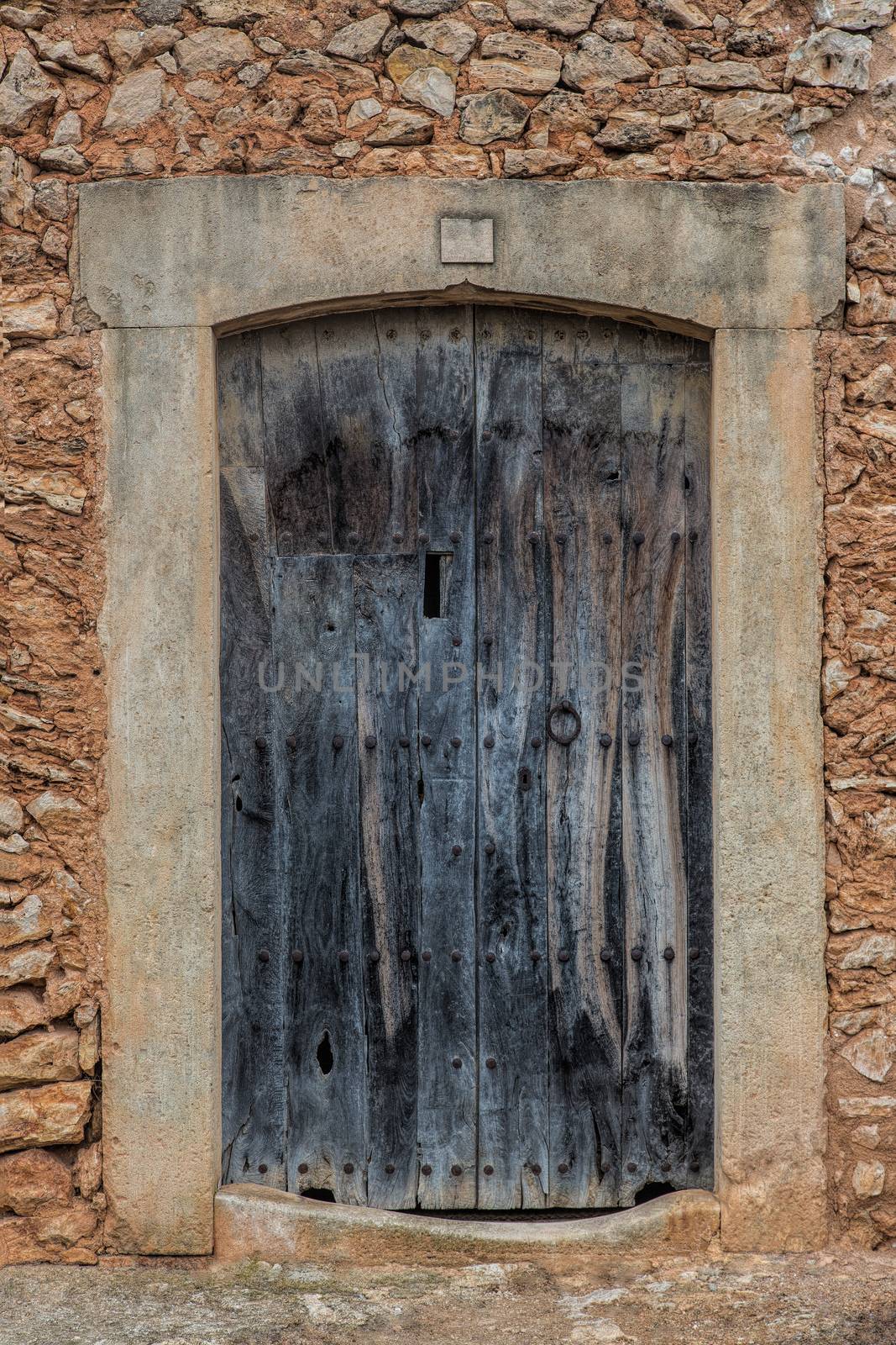Old wooden door in brick wall by sandra_fotodesign