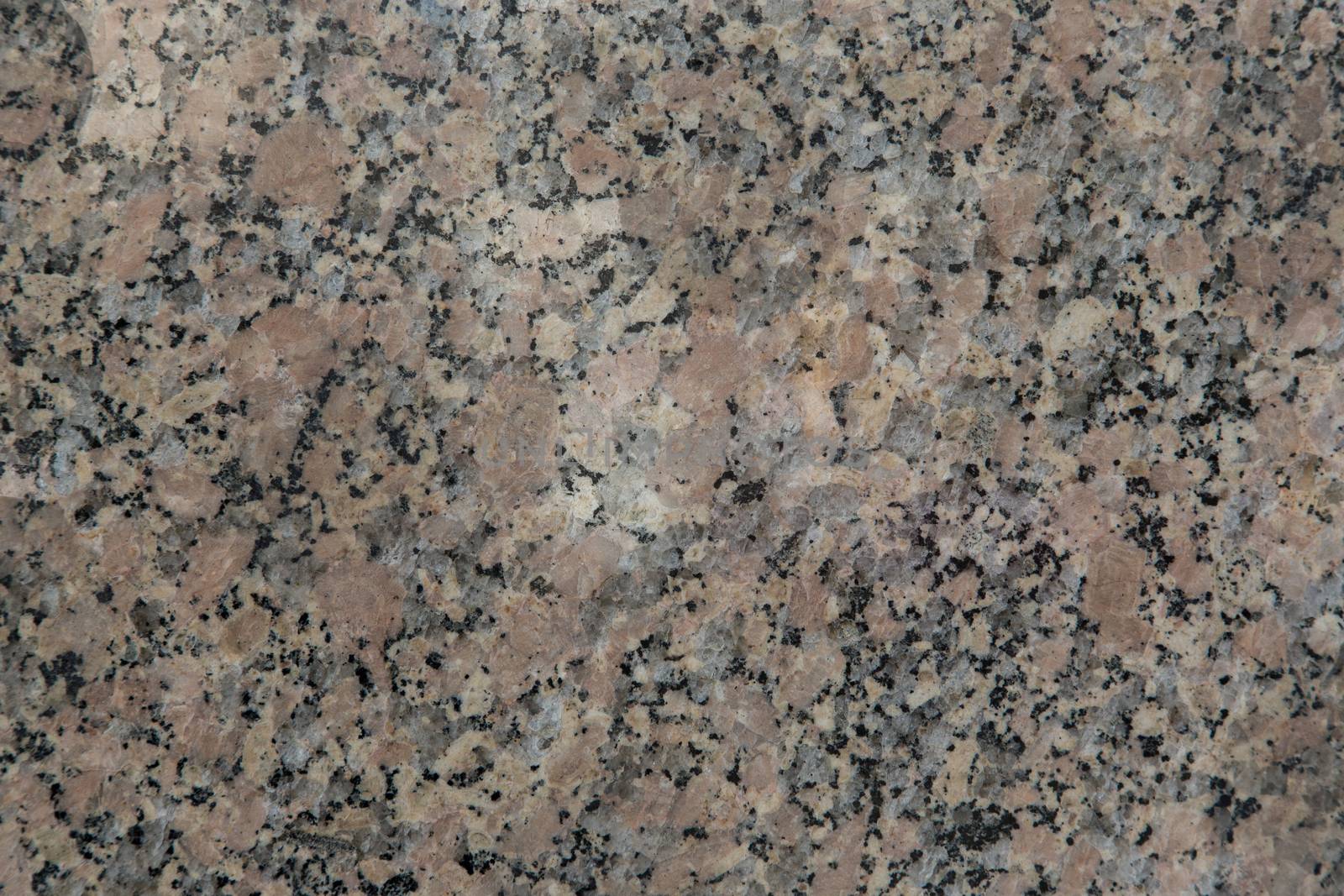 A grey wall of smooth marble