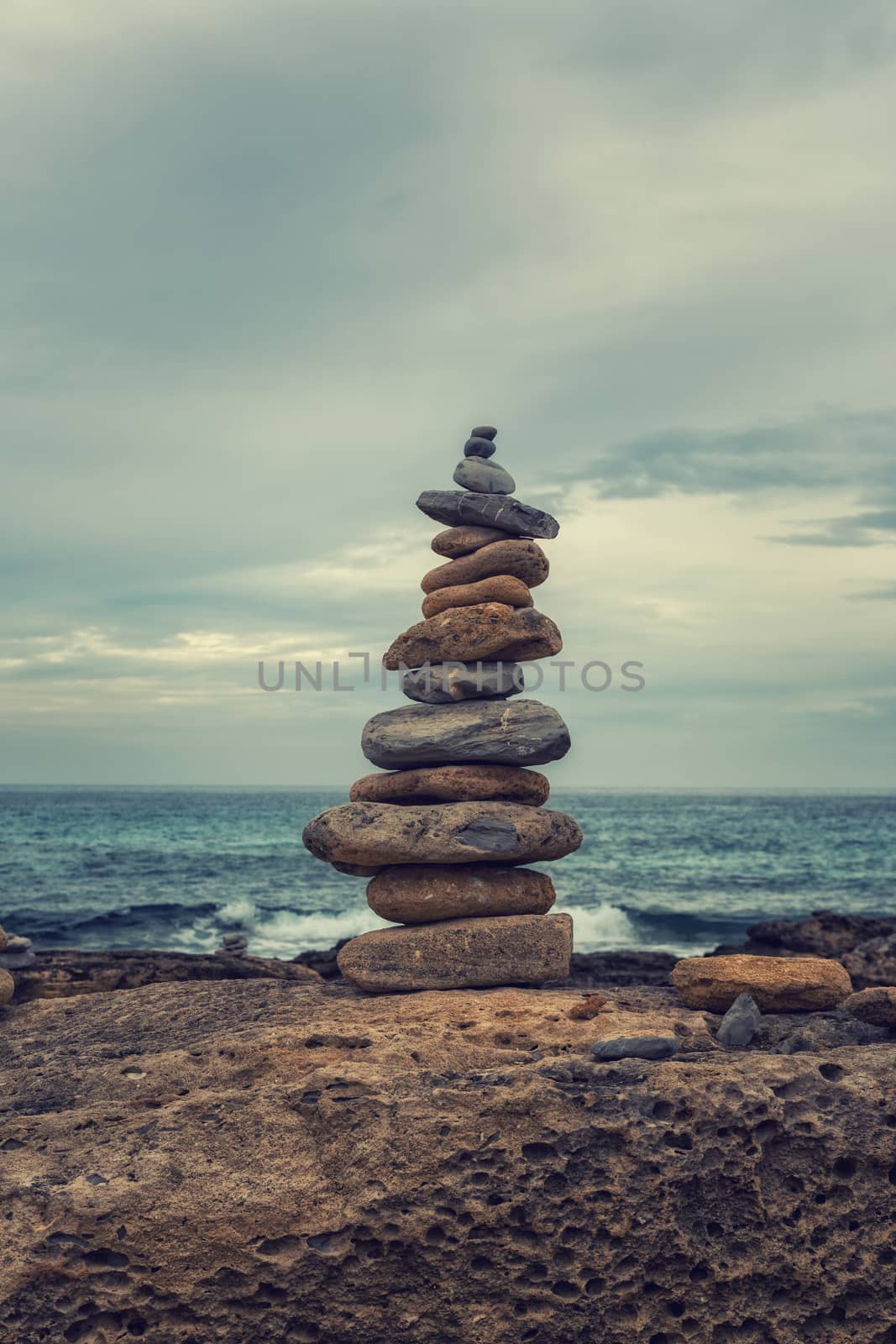 Small tower of stones on the coast by sandra_fotodesign