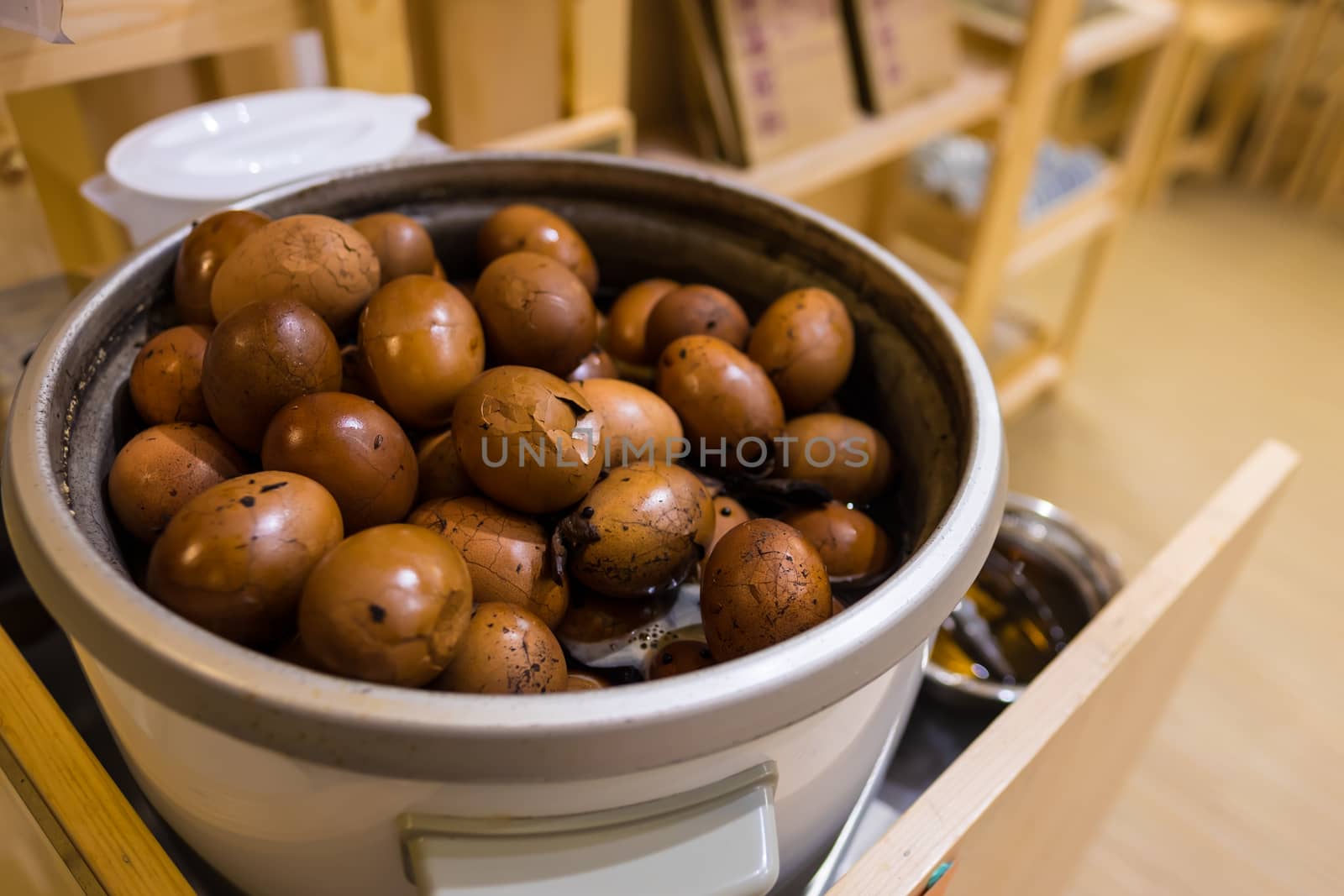 Tradional chinese herbal eggs in a big cooking pot for sale
