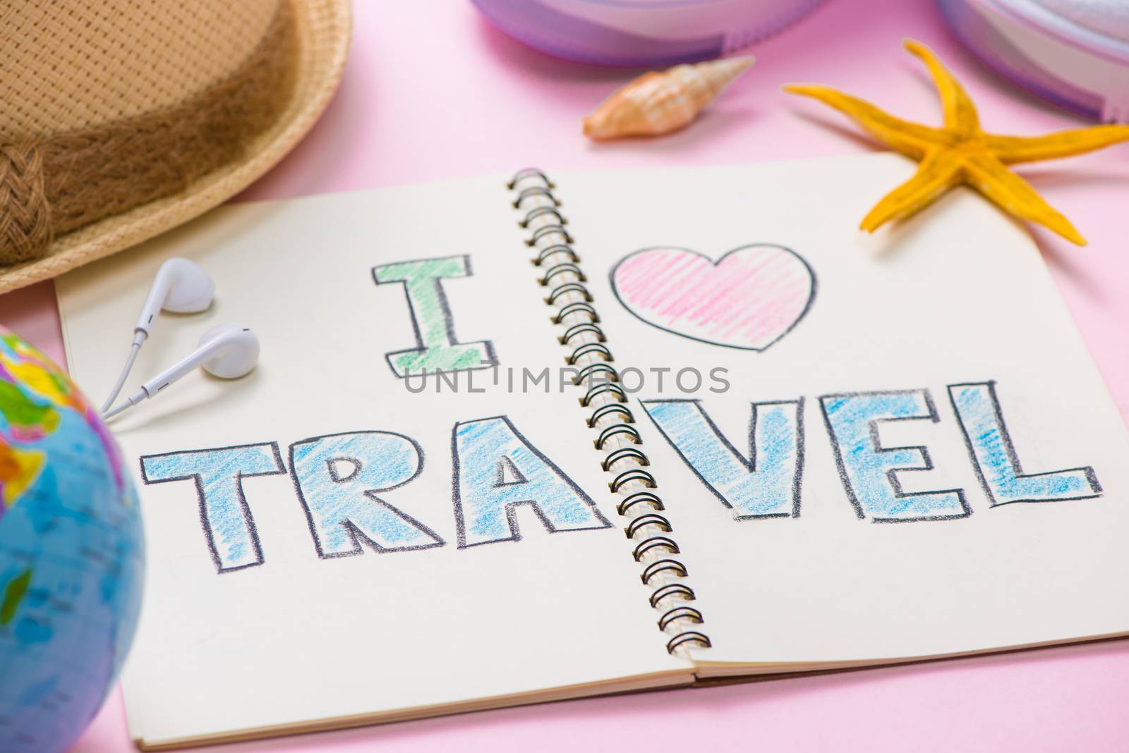 I love Travel written on pen notebook. Vacation Holiday Concept by makidotvn