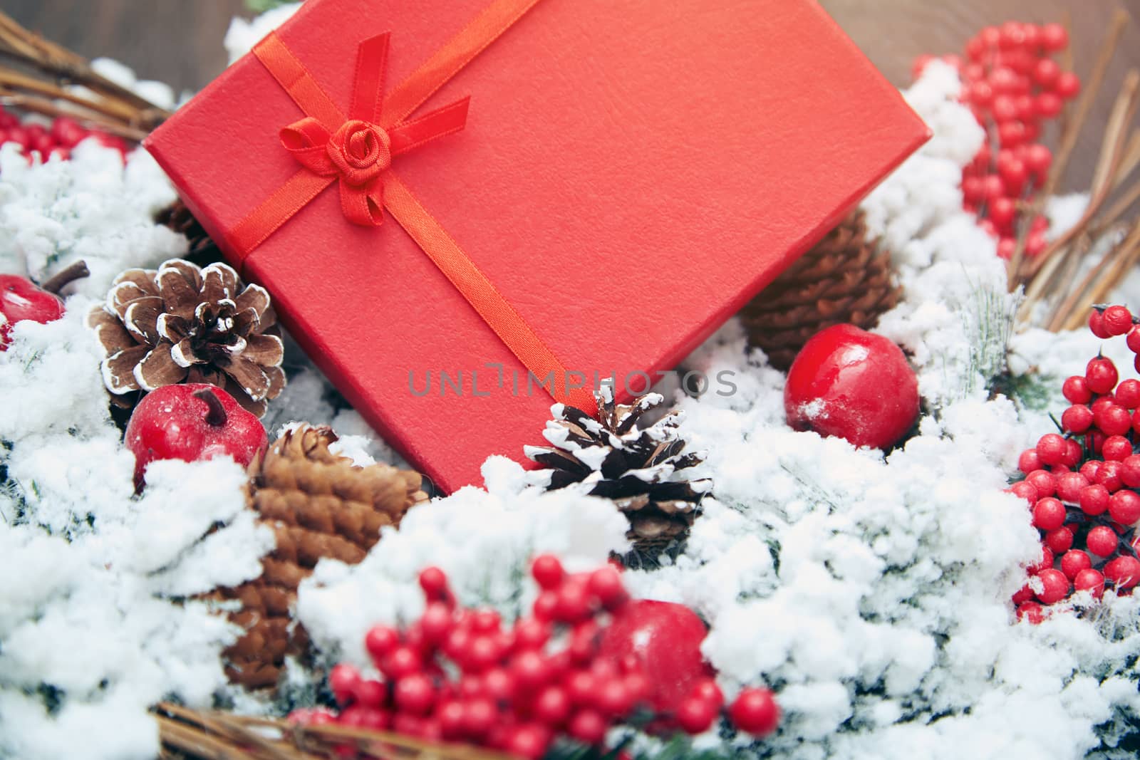 Christmas gift in a red box. Close-up horizontal photo