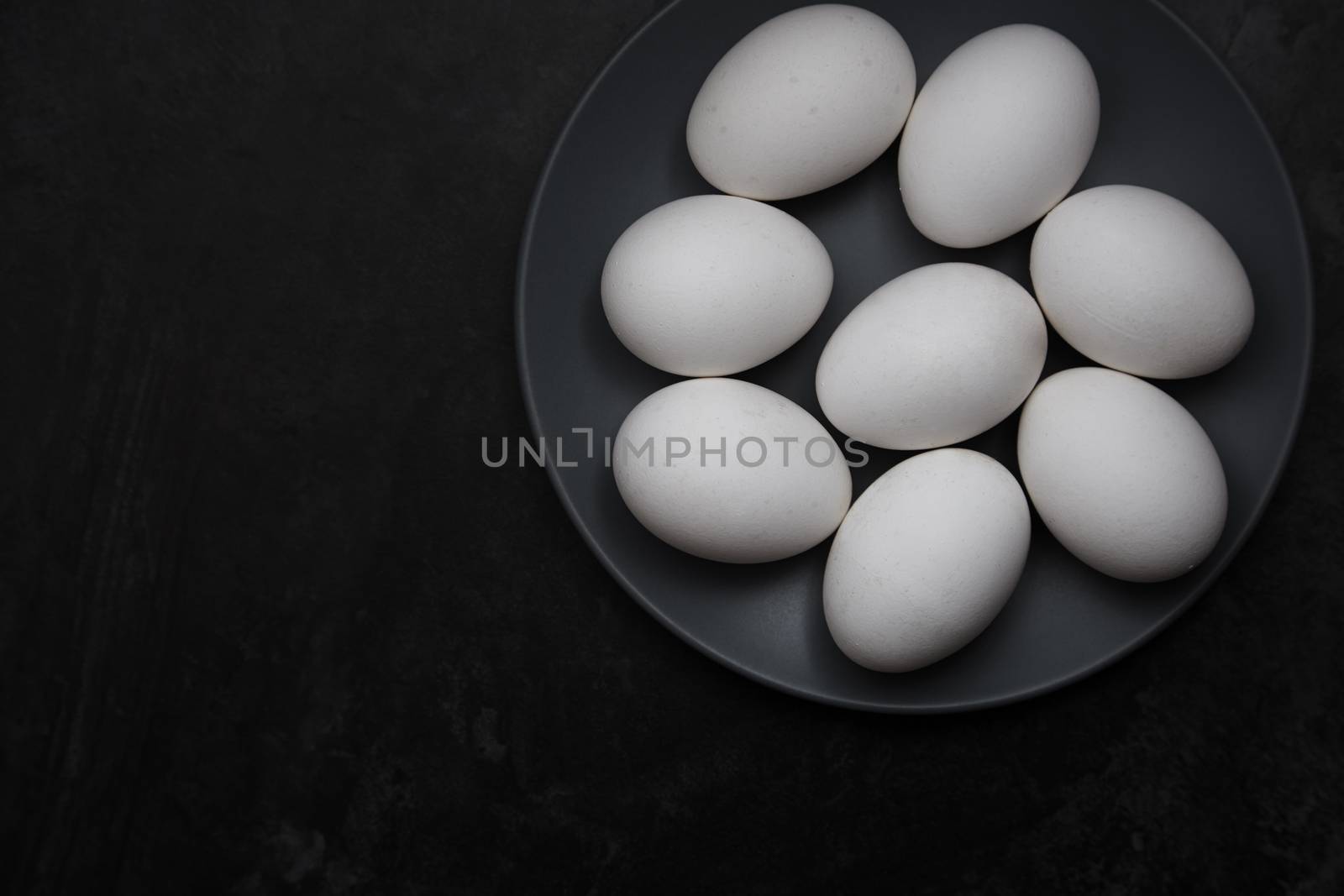 Chicken eggs on a plate by Novic