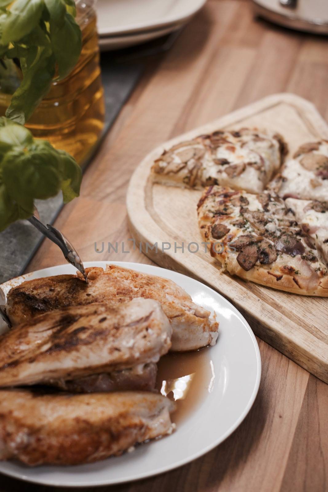 Tasty and fresh italian pizza in the kitchen on the wooden board.