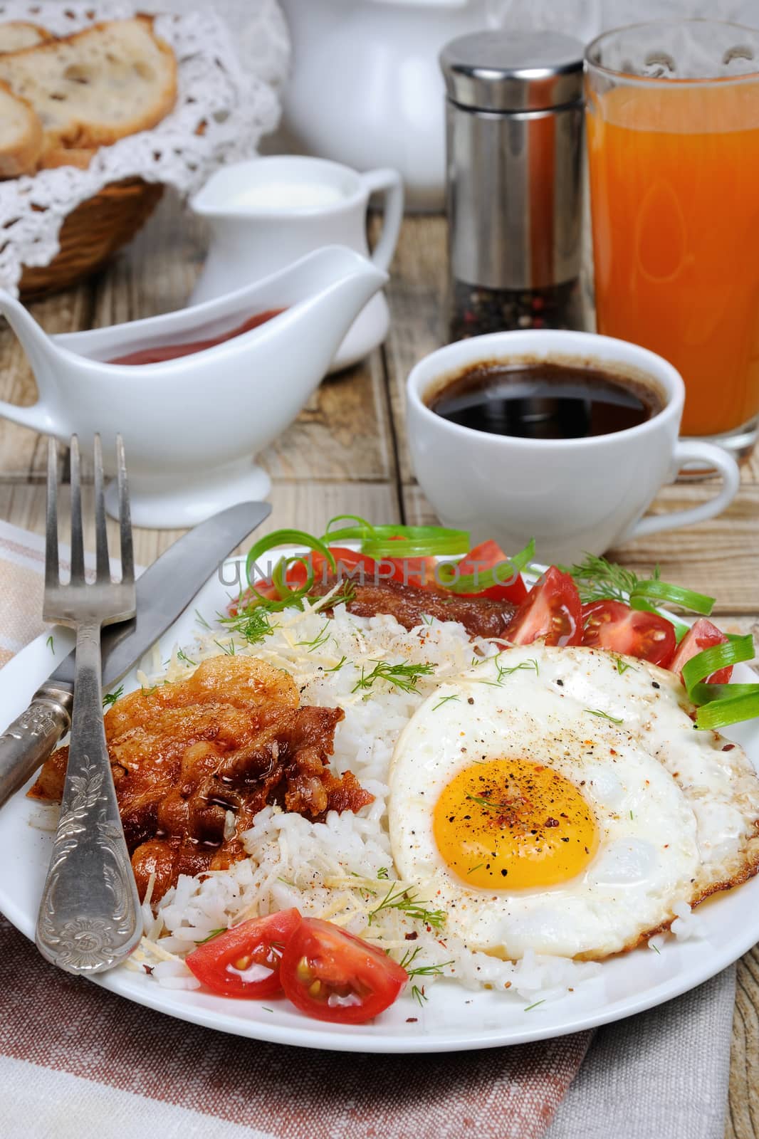   Breakfast - Soft boiled rice with scrambled eggs, bacon, tomato slices and greens 