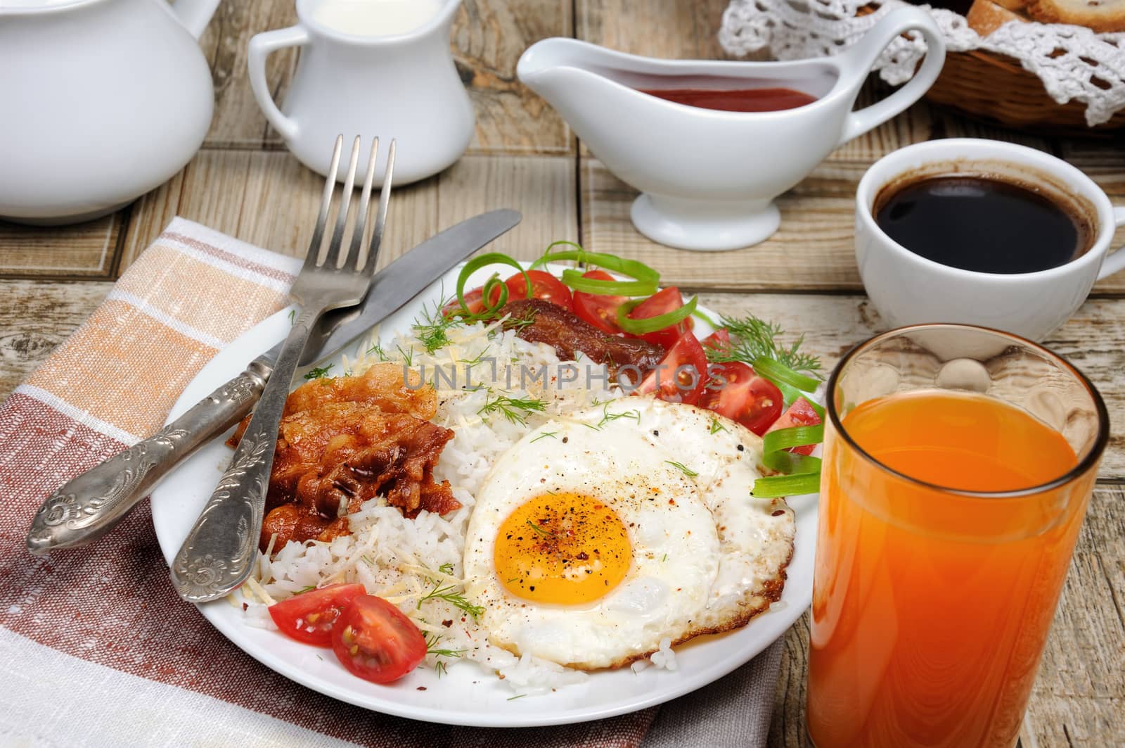  Breakfast - Soft boiled rice with scrambled eggs, bacon, tomato slices and greens