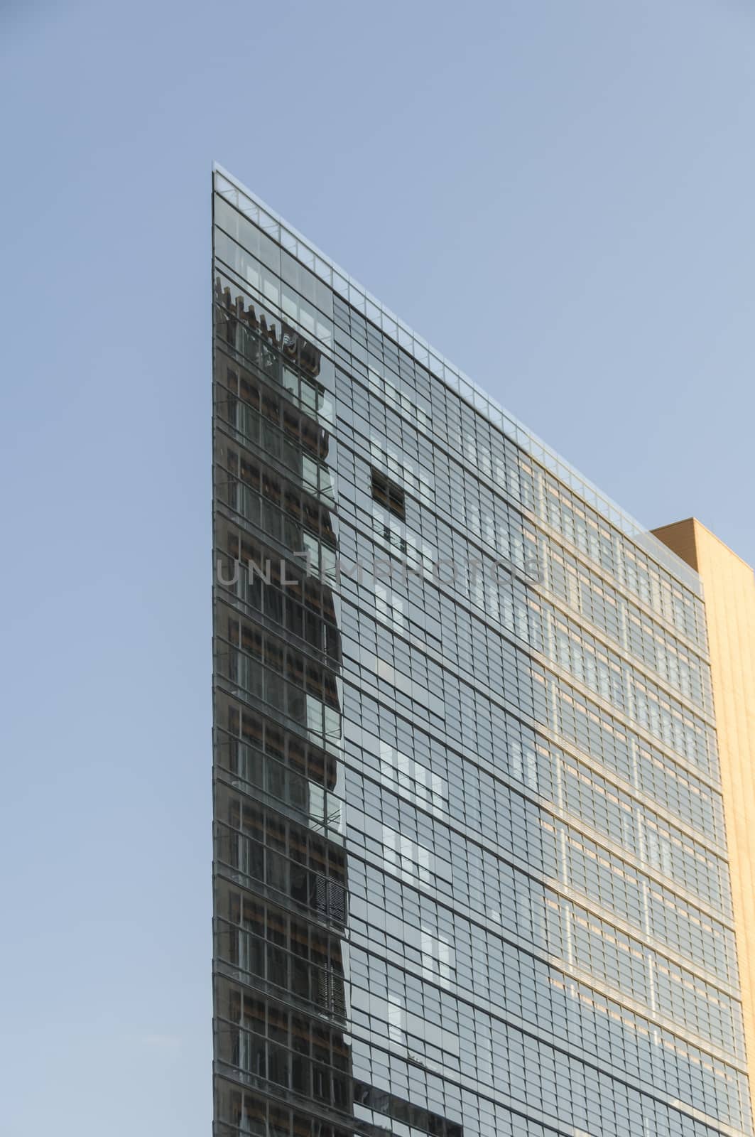 Sky reflected in the windows of a modern office building