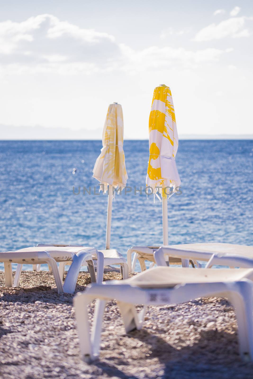 Parasols and chairs on the beach of Bol, Croatia