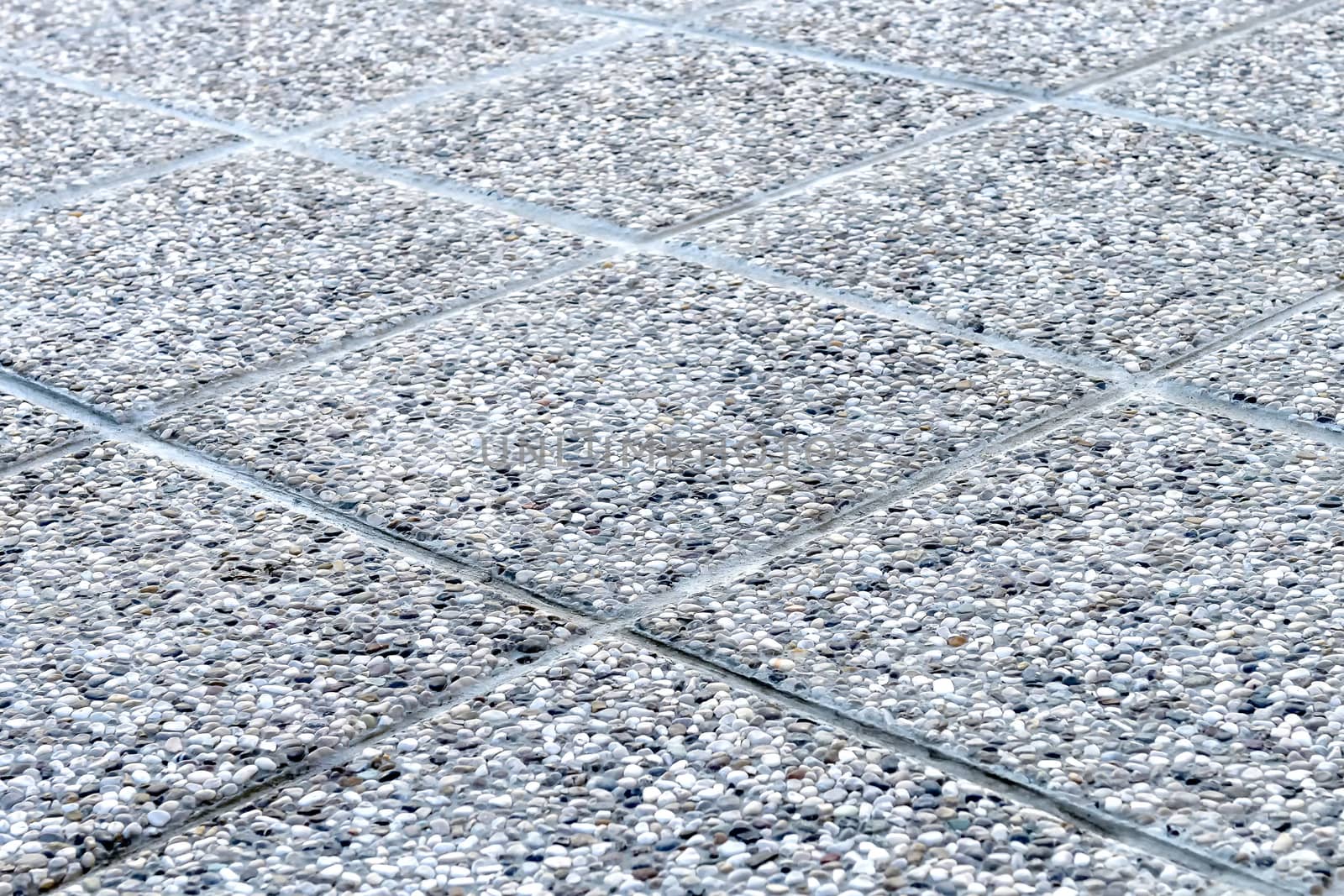 Detailed shot of pebbled tiles, outdoors terrace flooring