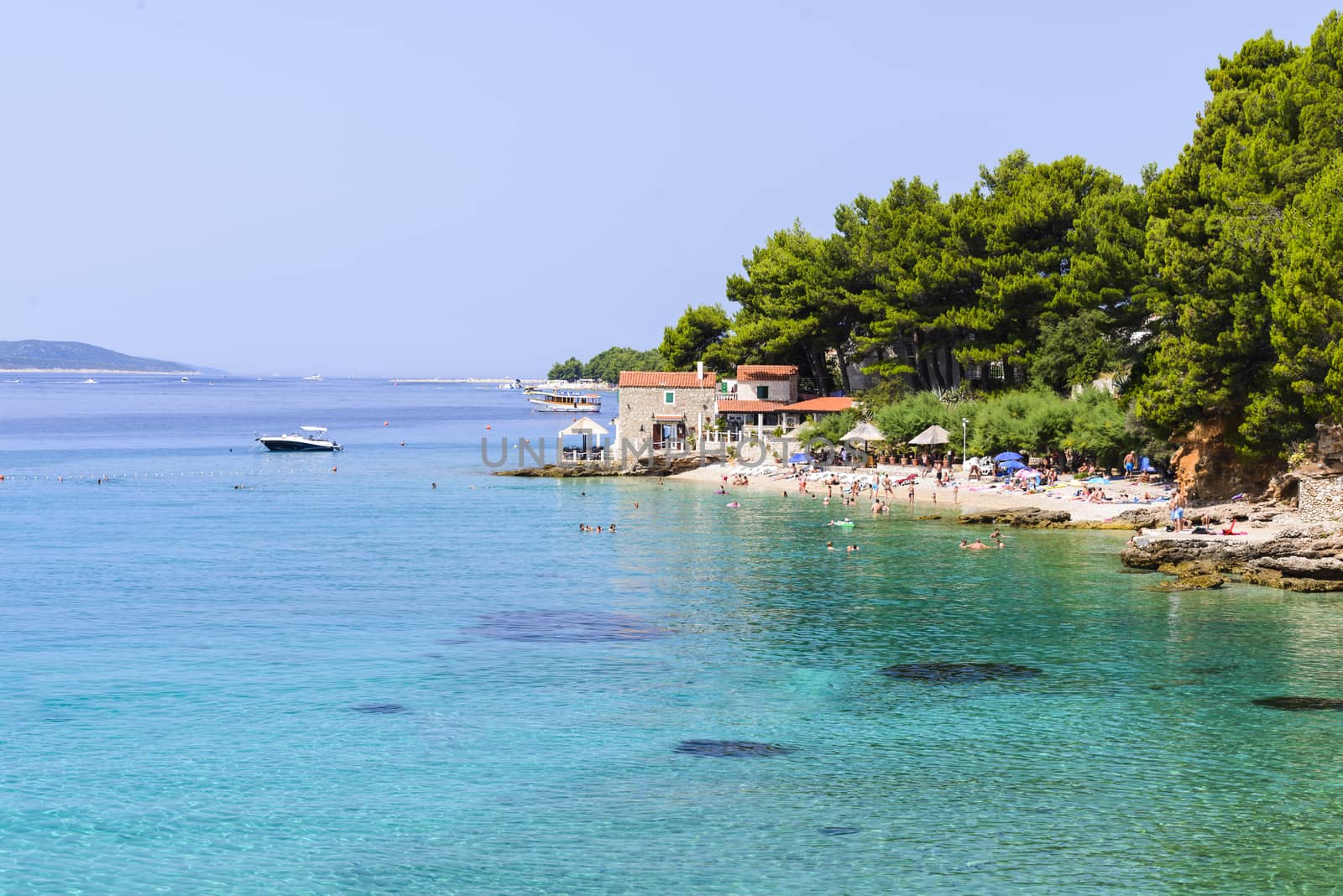 Famous beaches in the city of Bol, island Brac, Croatia full of turists in summer season
