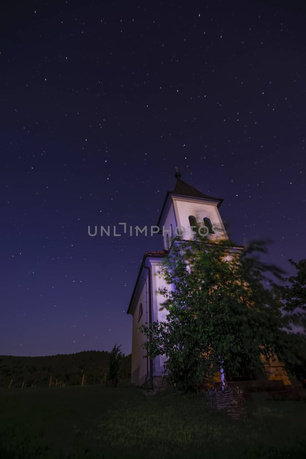 Church in clear, starry night with Ursa Maior - Big bear to the left and Polaris - North star to the right