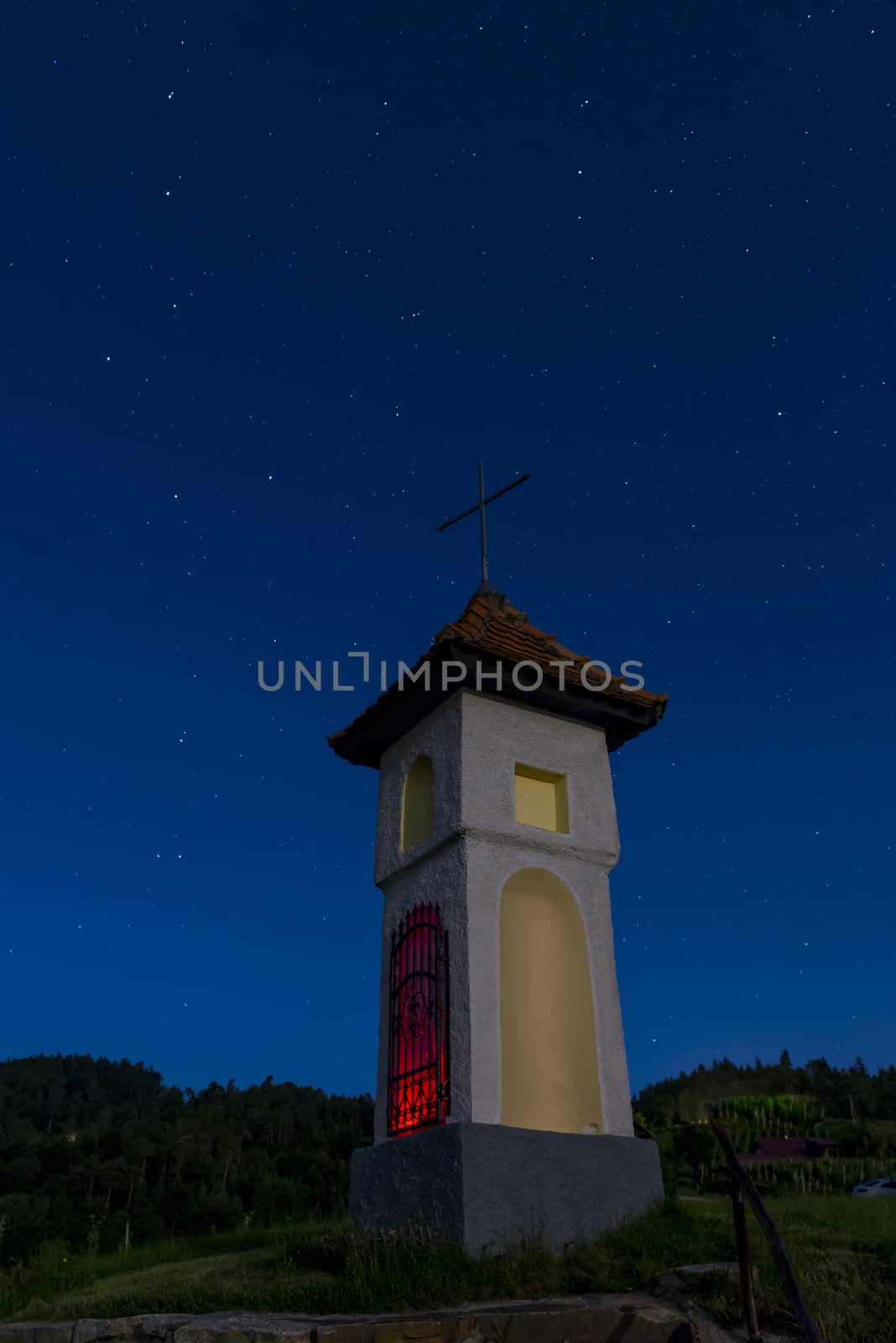 Church in clear, starry night with Ursa Maior - Big bear to the left and Polaris - North star to the right