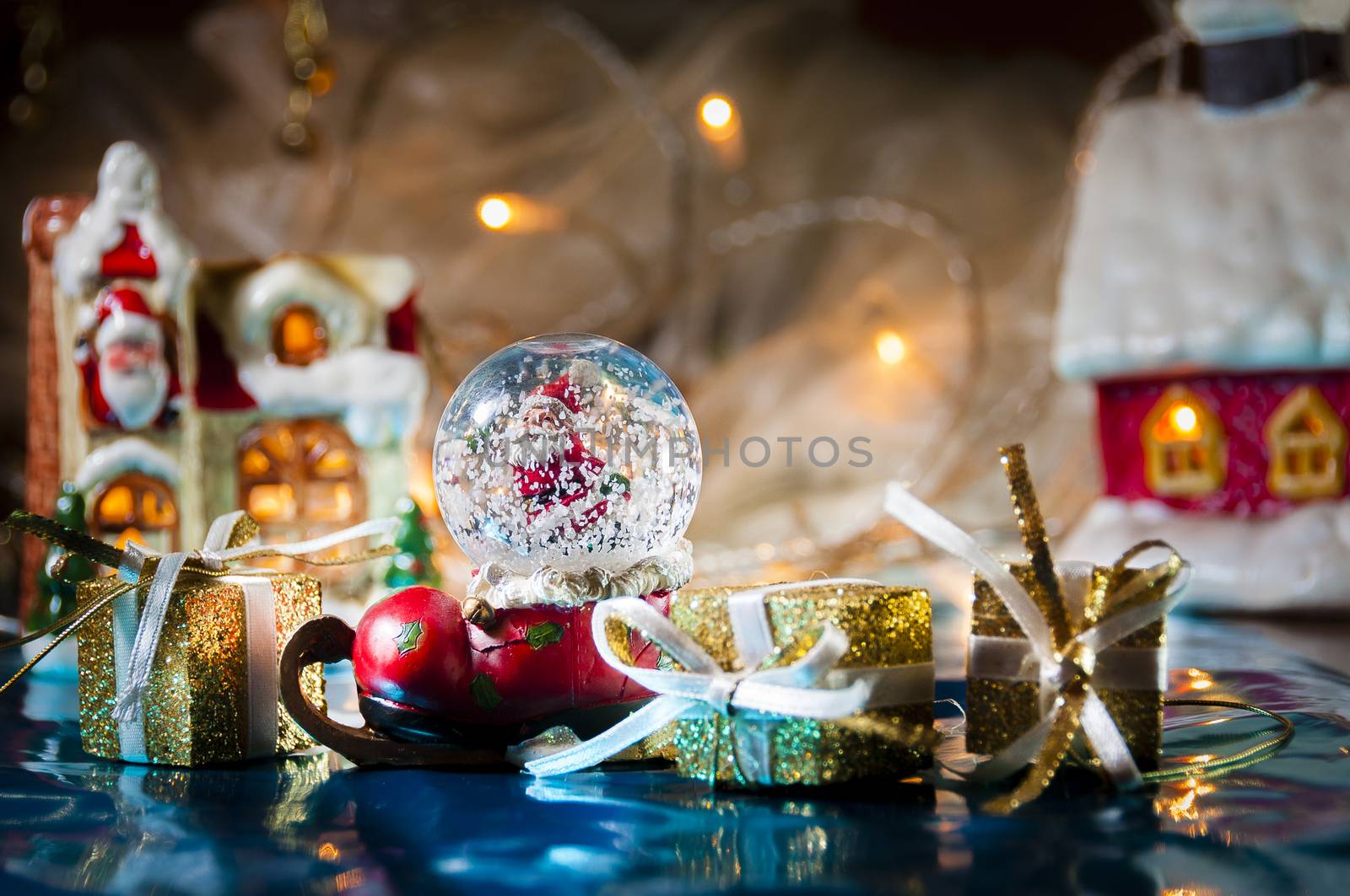 Christmas still life with Santa's snowball and lights in the background, selective focus