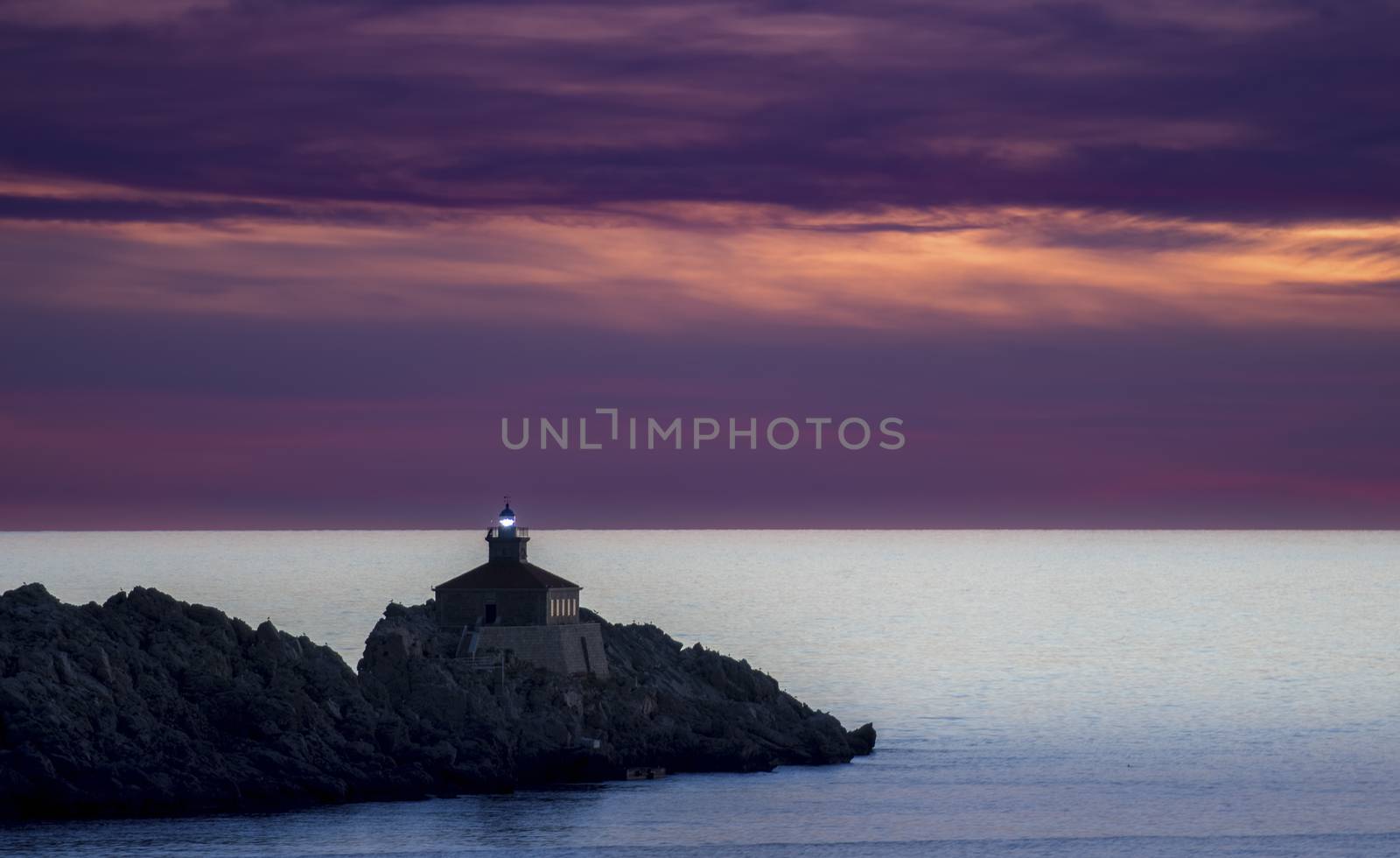 Lighthouse in sunset; island Grebeni, Dubrovnik, Croatia by asafaric