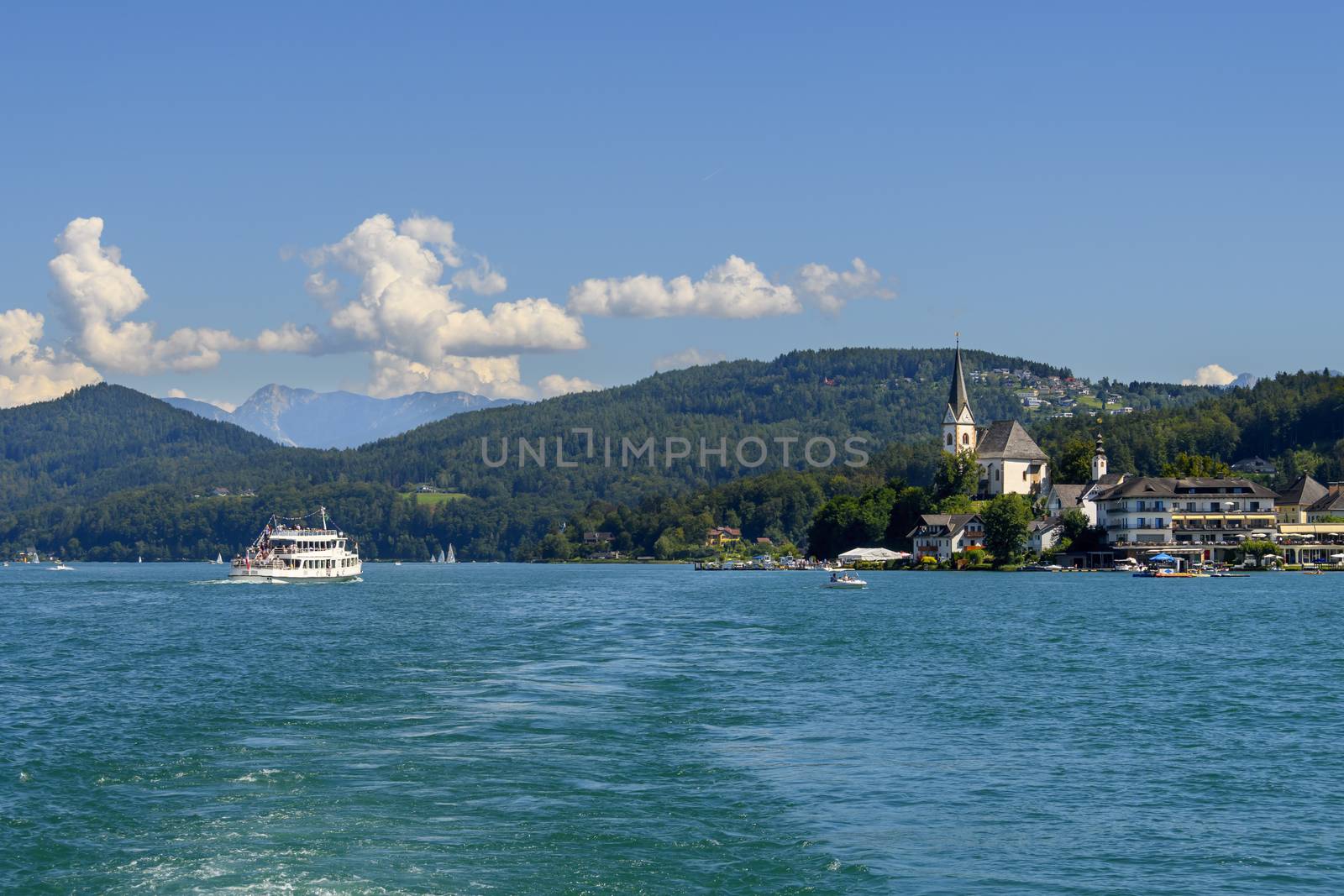View from the lake on the picturescue village of Maria Worth on Worthersee in Austria