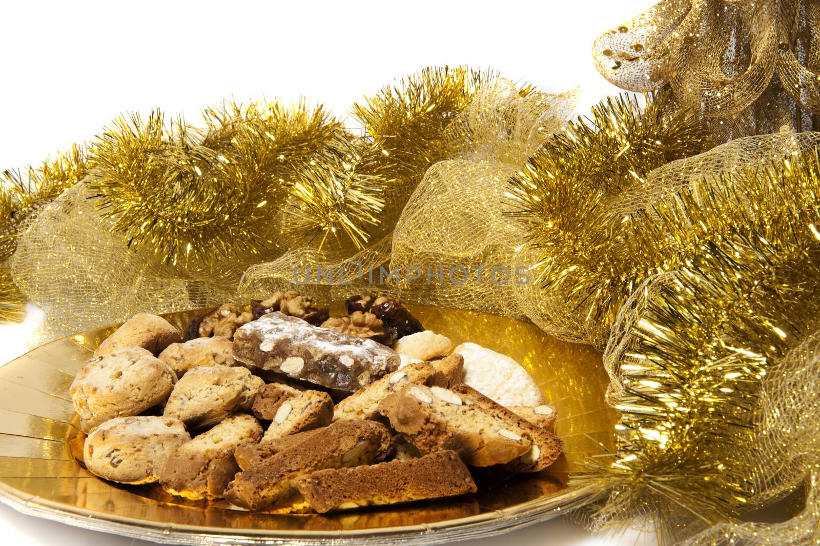 Christmas cookies over a golden plate on a white background