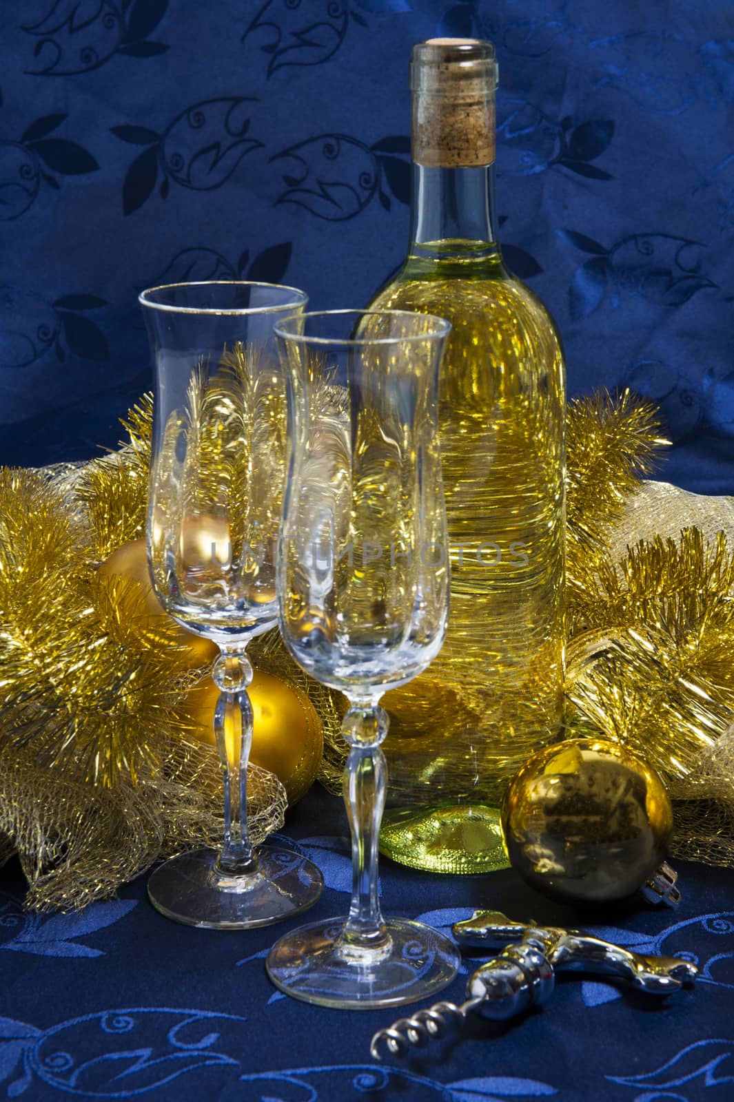 Bottle of white wine, glasses and Christmas decorations by carla720